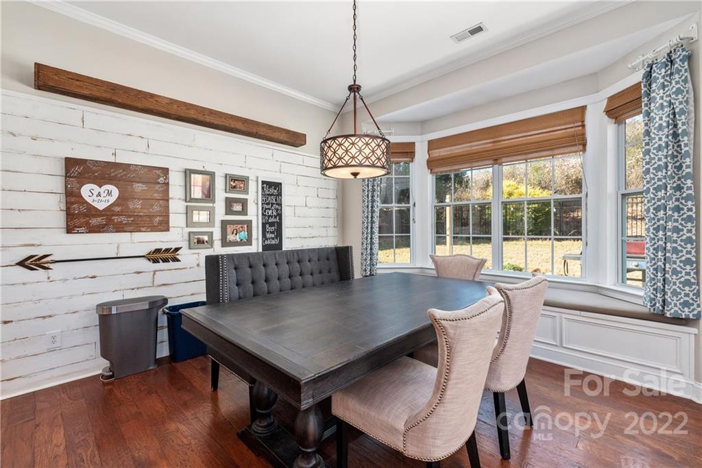 1235 Gold Rush Court Fort Mill, SC 29708 - Photo 19 of 42 a view of a dining room with furniture window and wooden floor