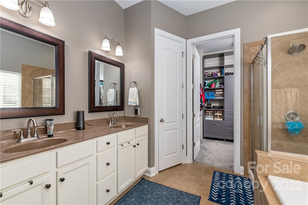 1235 Gold Rush Court Fort Mill, SC 29708 - Photo 23 of 42 a walk in closet with view of bathroom and bathroom