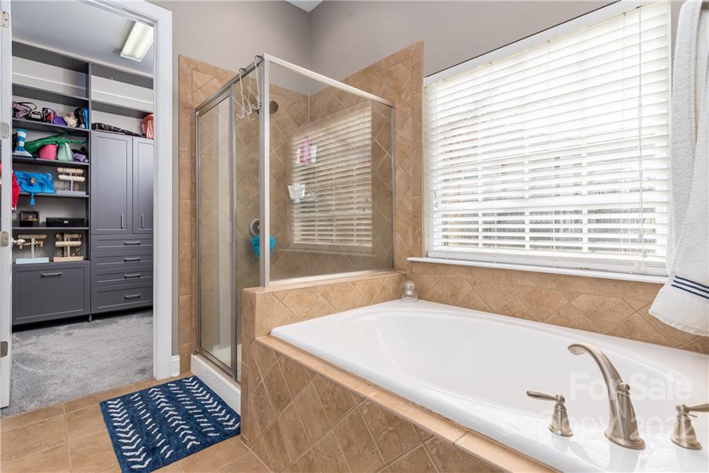 1235 Gold Rush Court Fort Mill, SC 29708 - Photo 24 of 42 a bath tub sitting in a bathroom next to a window