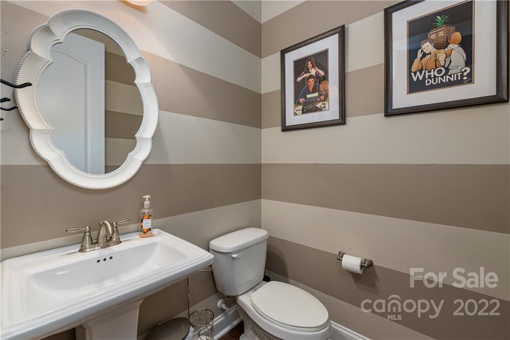 1235 Gold Rush Court Fort Mill, SC 29708 - Photo 27 of 42 a bathroom with a toilet a sink and a mirror