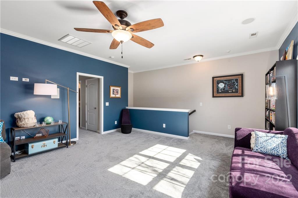 1235 Gold Rush Court Fort Mill, SC 29708 - Photo 30 of 42 a living room with furniture and a ceiling fan