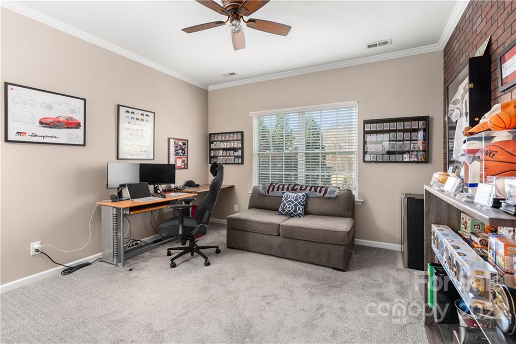 1235 Gold Rush Court Fort Mill, SC 29708 - Photo 32 of 42 a living room with furniture and a flat screen tv