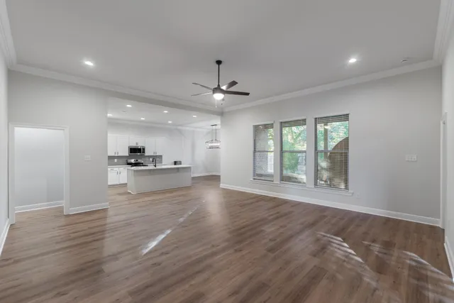 a kitchen with stainless steel appliances a refrigerator stove microwave and sink