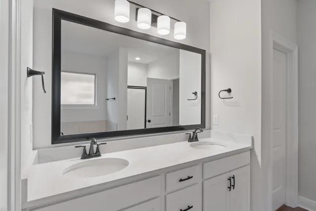 a bathroom with a bathtub and a shower