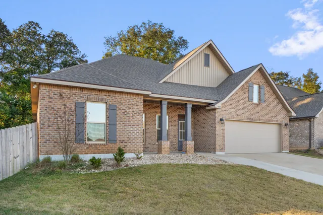 a front view of a house with a couple of windows
