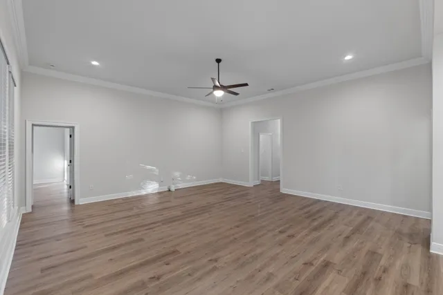 a view of kitchen with refrigerator and window
