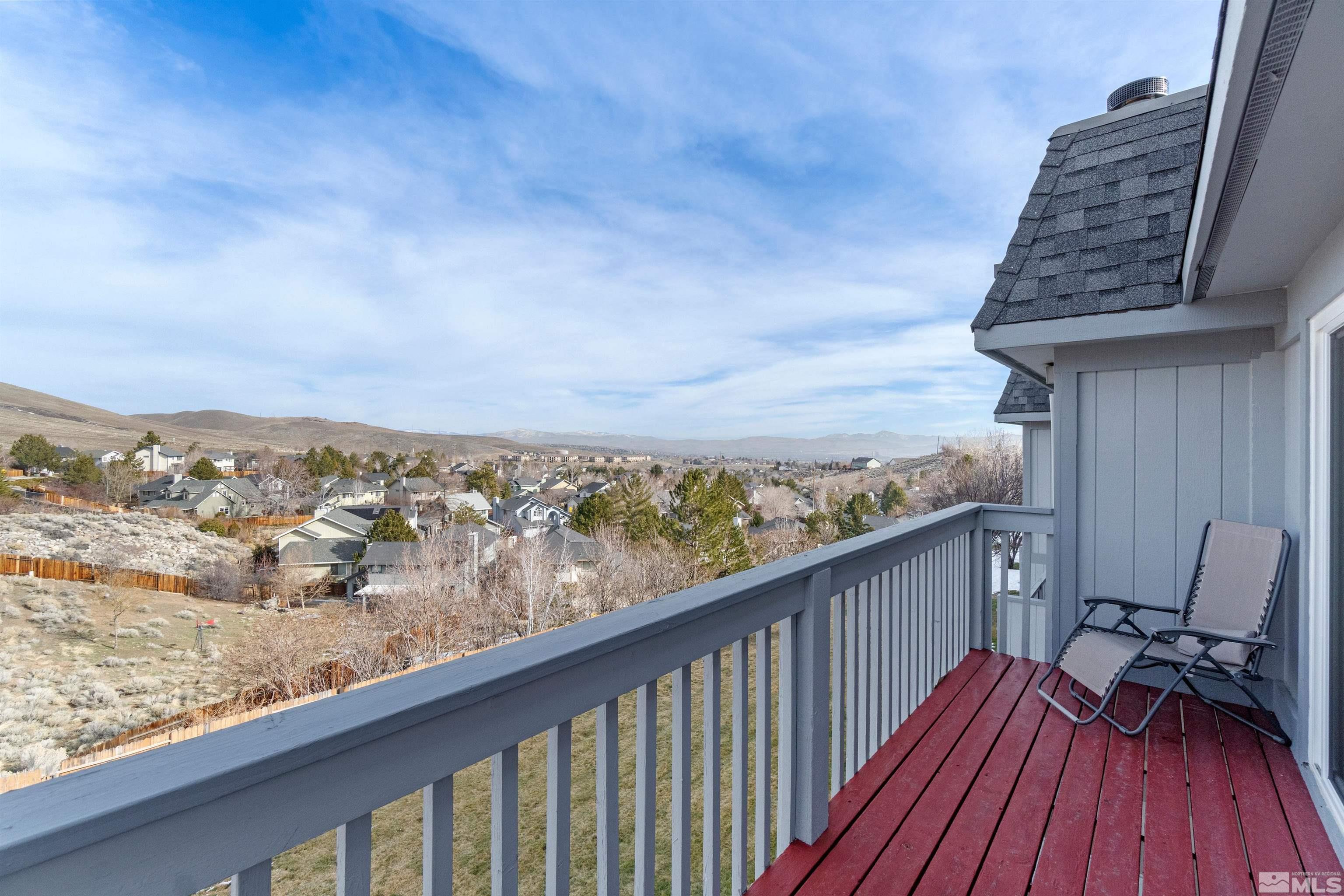 3971 Kings Row Reno, NV 89503 - Photo 1 of 29 a balcony with wooden floor and city view