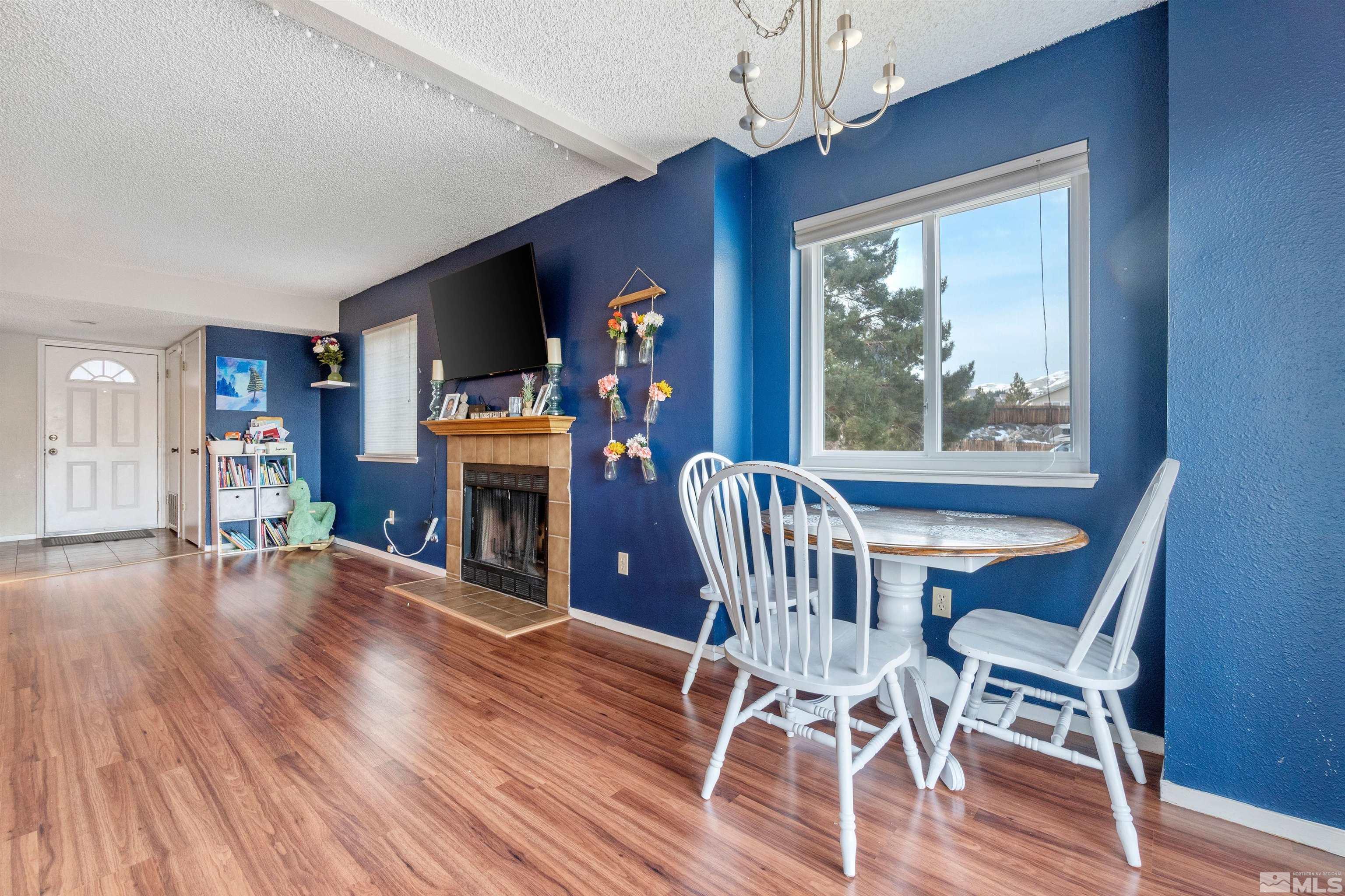 3971 Kings Row Reno, NV 89503 - Photo 13 of 29 a view of a dining room with furniture window and wooden floor