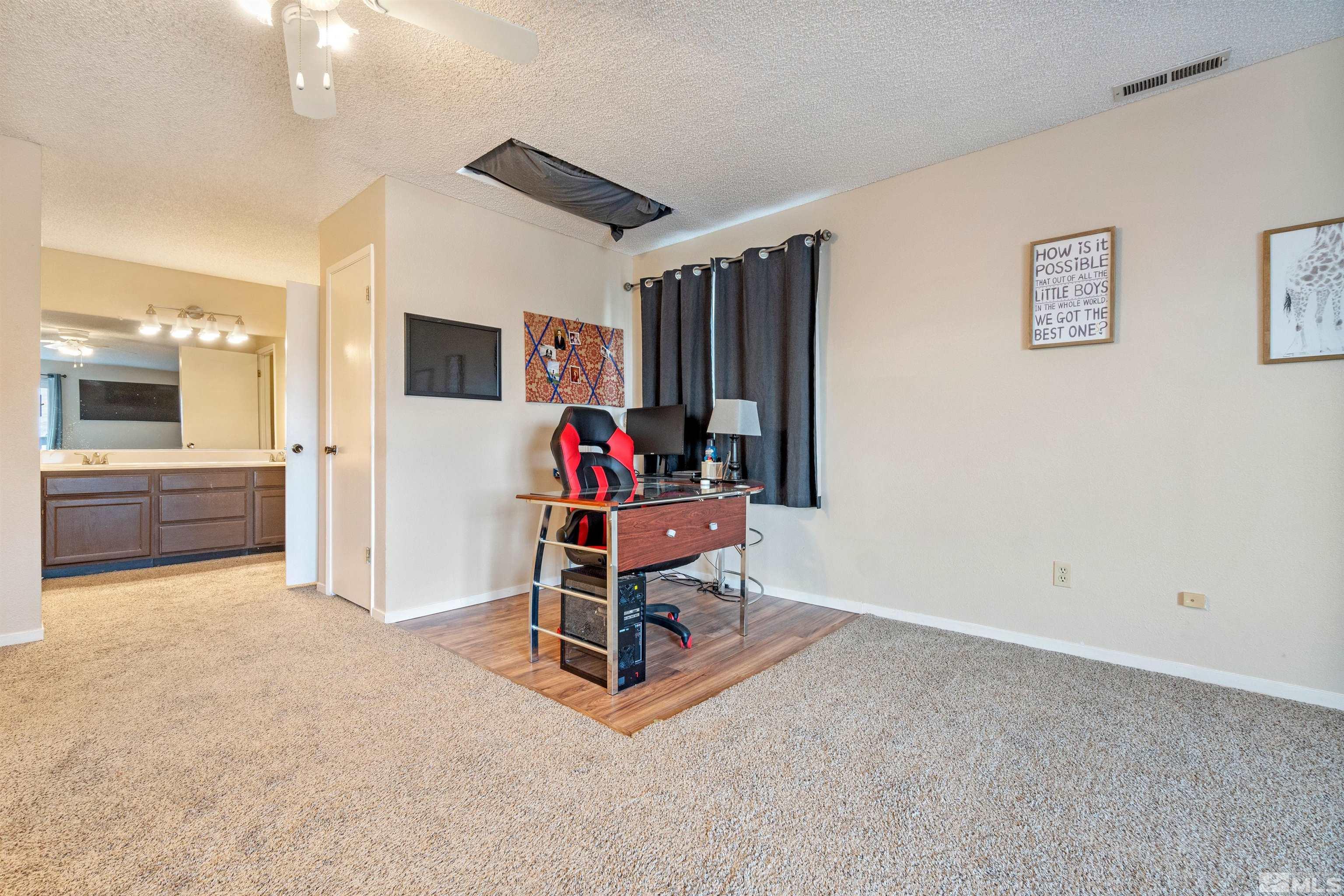 3971 Kings Row Reno, NV 89503 - Photo 23 of 29 a view of a livingroom with furniture and a flat screen tv