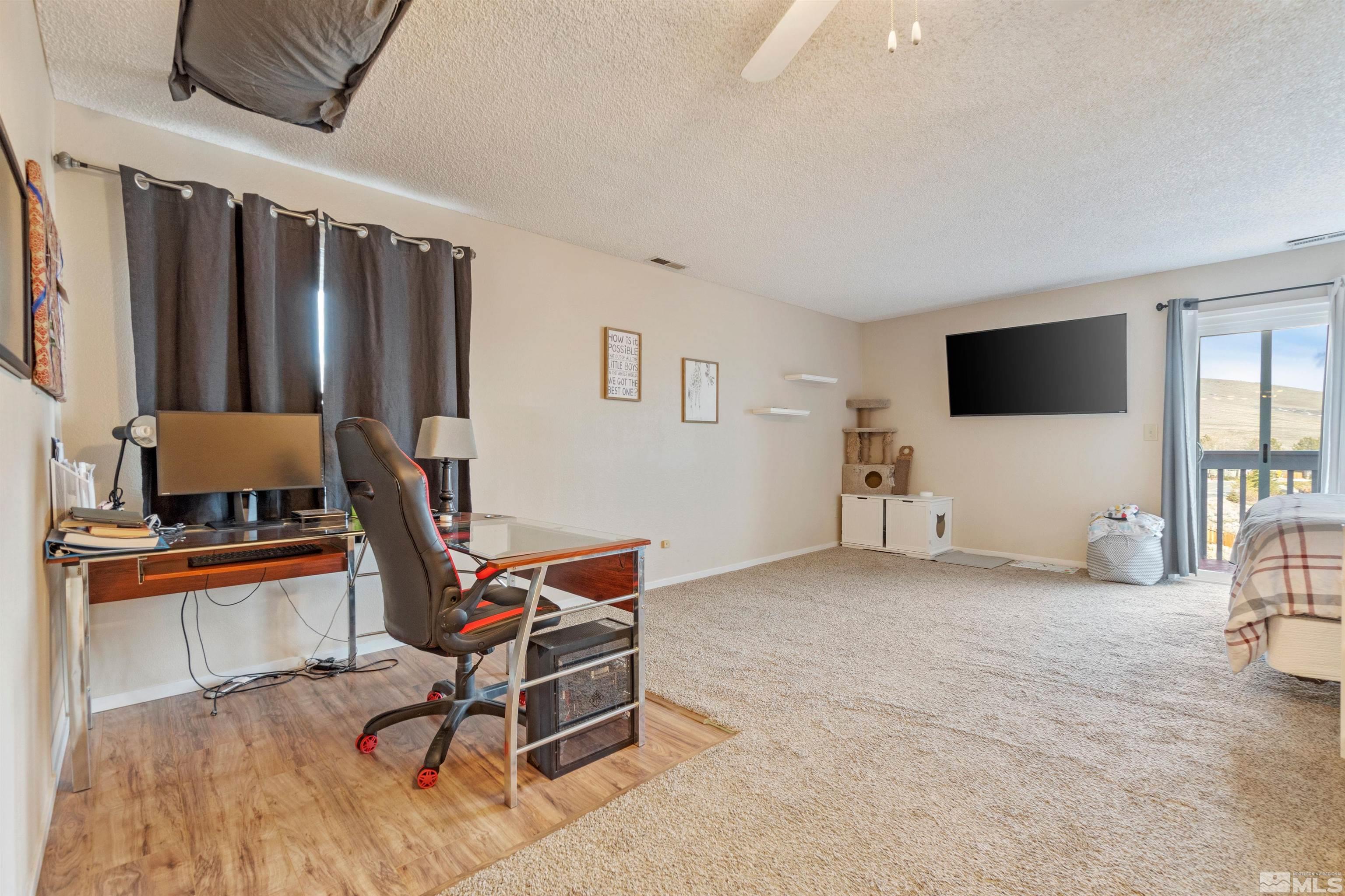 3971 Kings Row Reno, NV 89503 - Photo 24 of 29 a living room with furniture and a flat screen tv