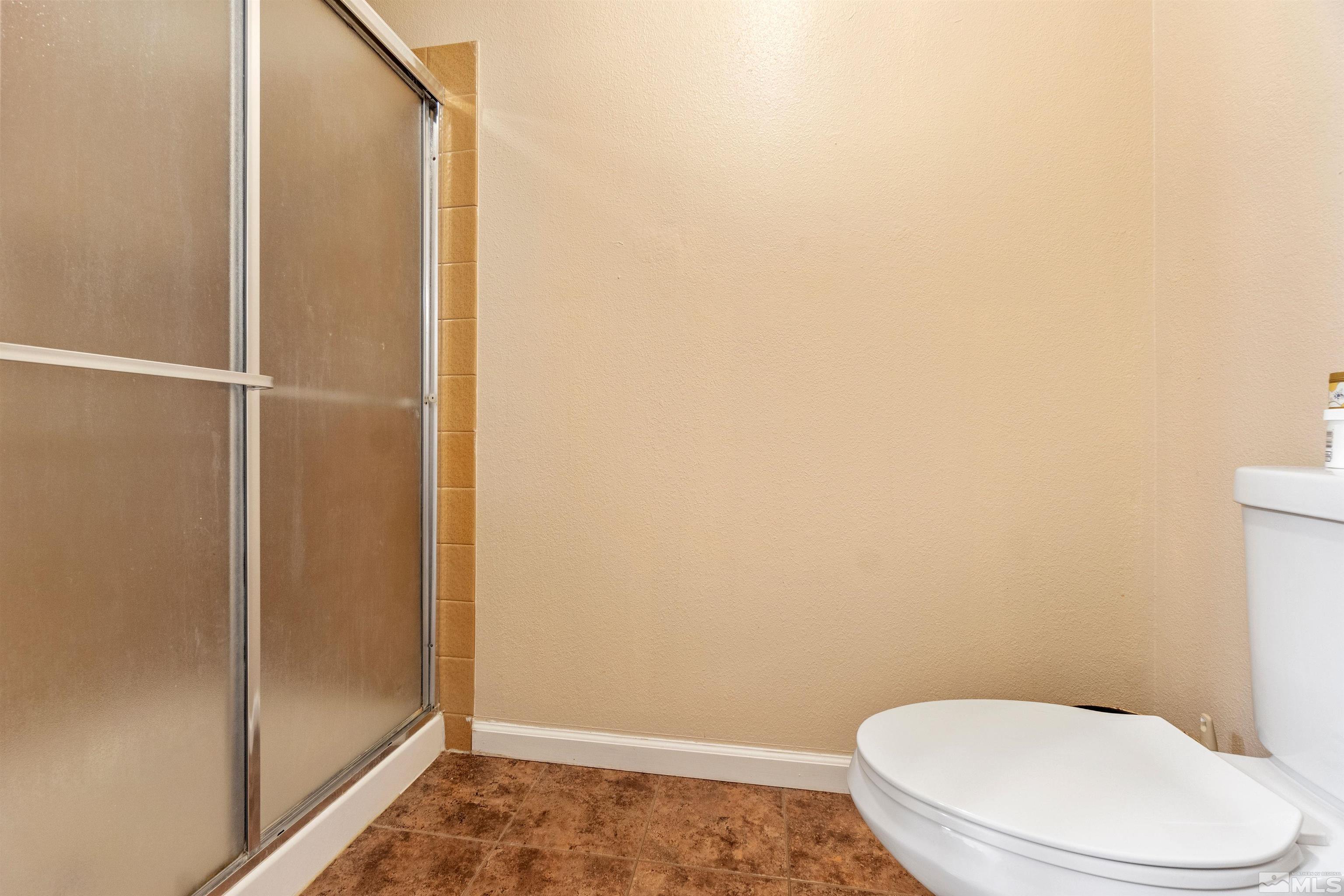 3971 Kings Row Reno, NV 89503 - Photo 29 of 29 a white toilet sitting next to a shower