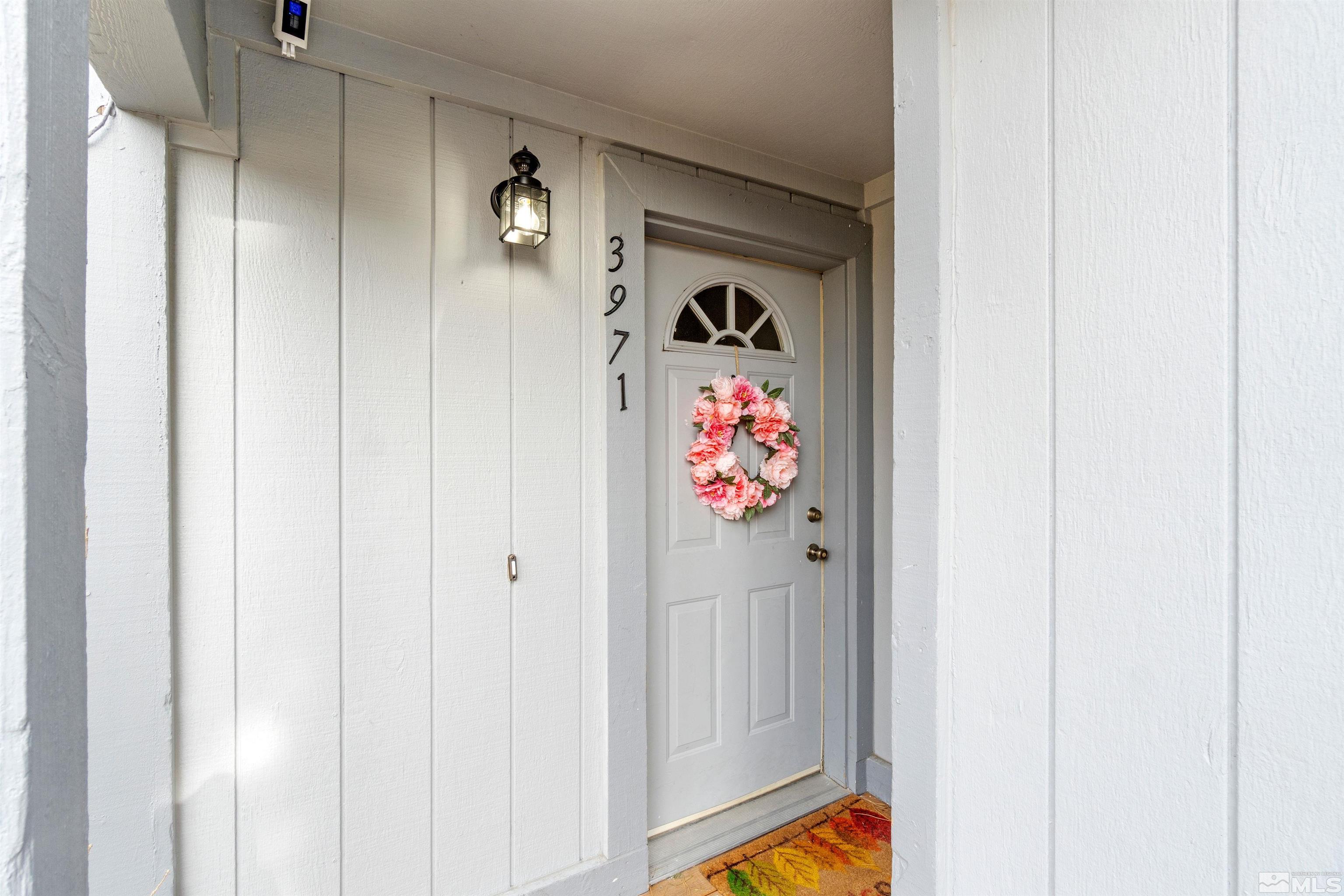 3971 Kings Row Reno, NV 89503 - Photo 5 of 29 a view of a hallway with painting on the wall