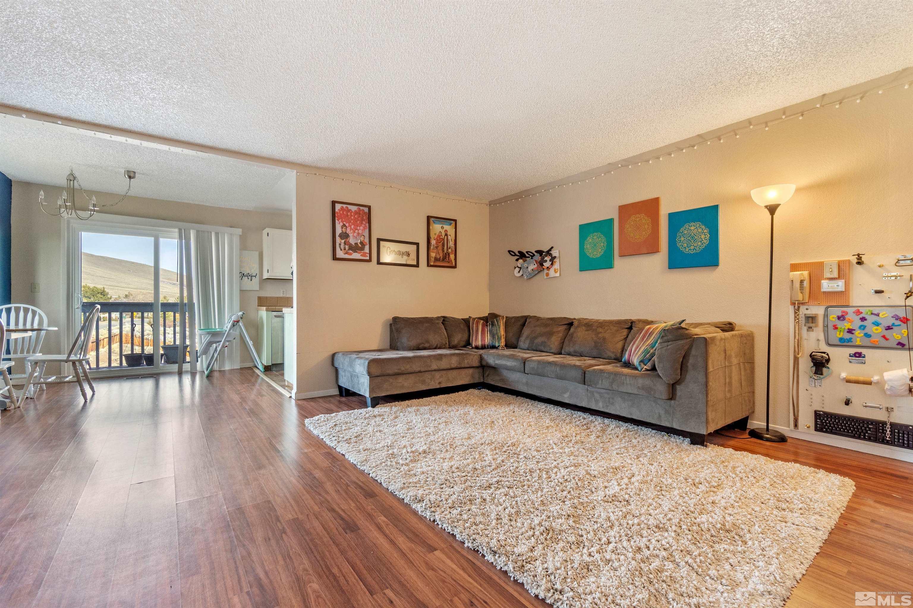 3971 Kings Row Reno, NV 89503 - Photo 8 of 29 a living room with furniture and a wooden floor