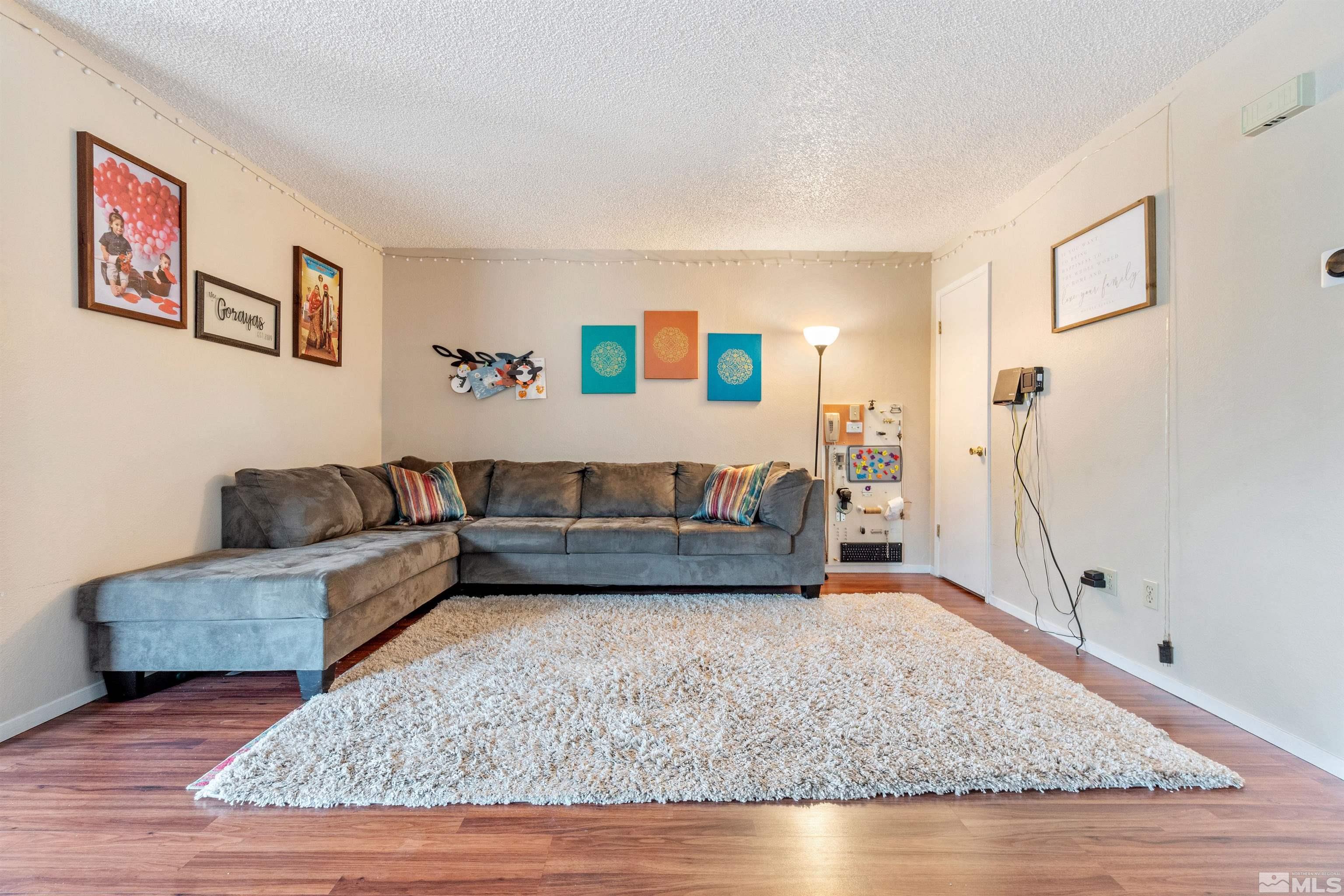 3971 Kings Row Reno, NV 89503 - Photo 9 of 29 a living room with furniture and a couch