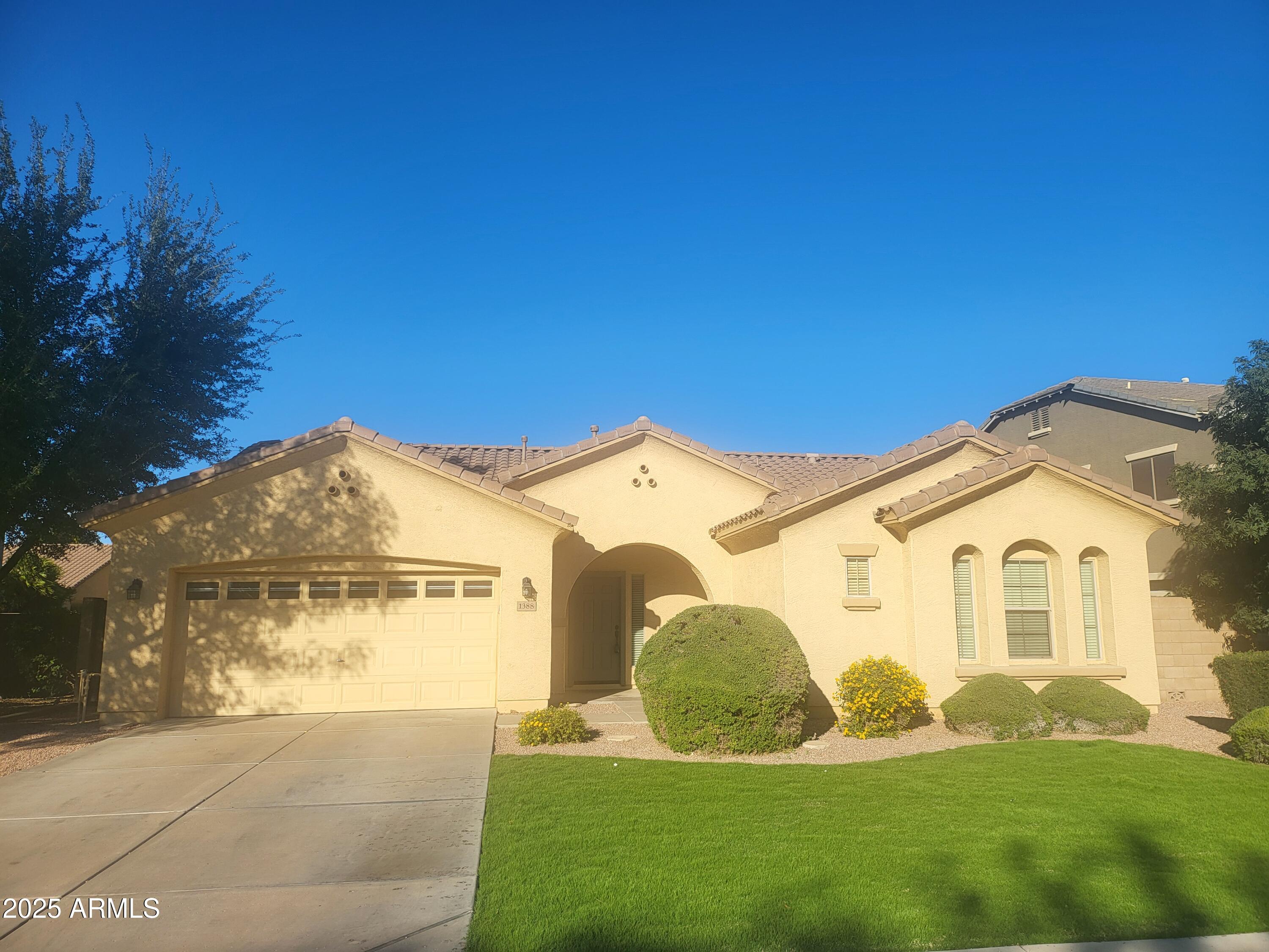 1388 East Boston Street Gilbert, AZ 85295 - Photo 1 of 13 a view of a house with a yard