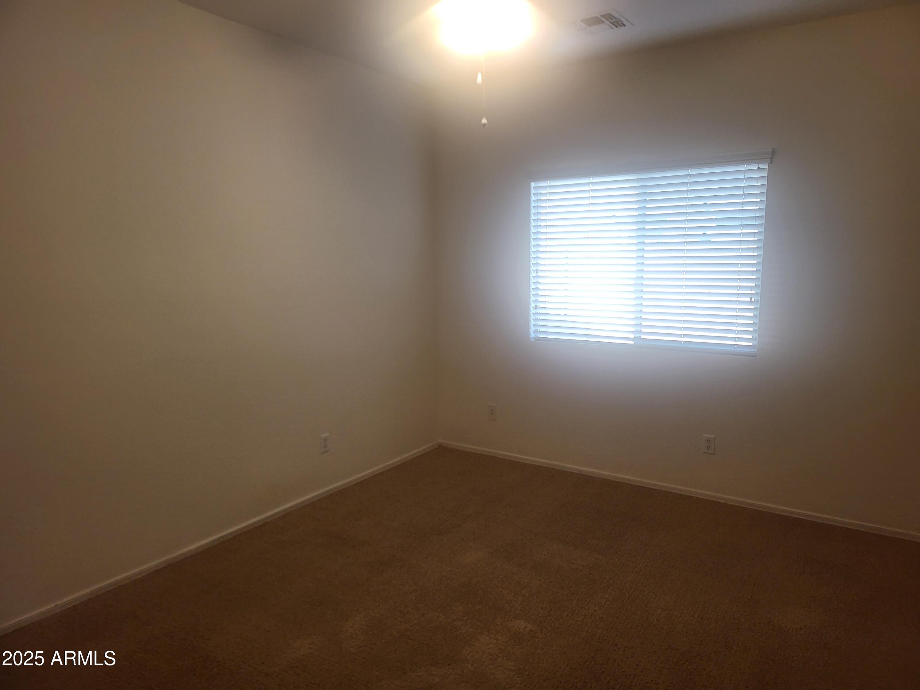 1388 East Boston Street Gilbert, AZ 85295 - Photo 11 of 13 an empty room with a window