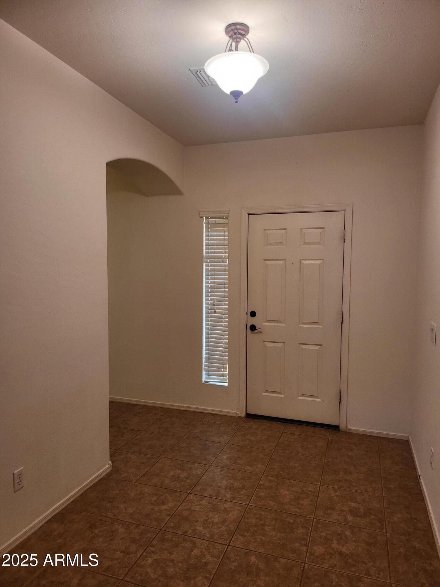 1388 East Boston Street Gilbert, AZ 85295 - Photo 3 of 13 an empty room with windows