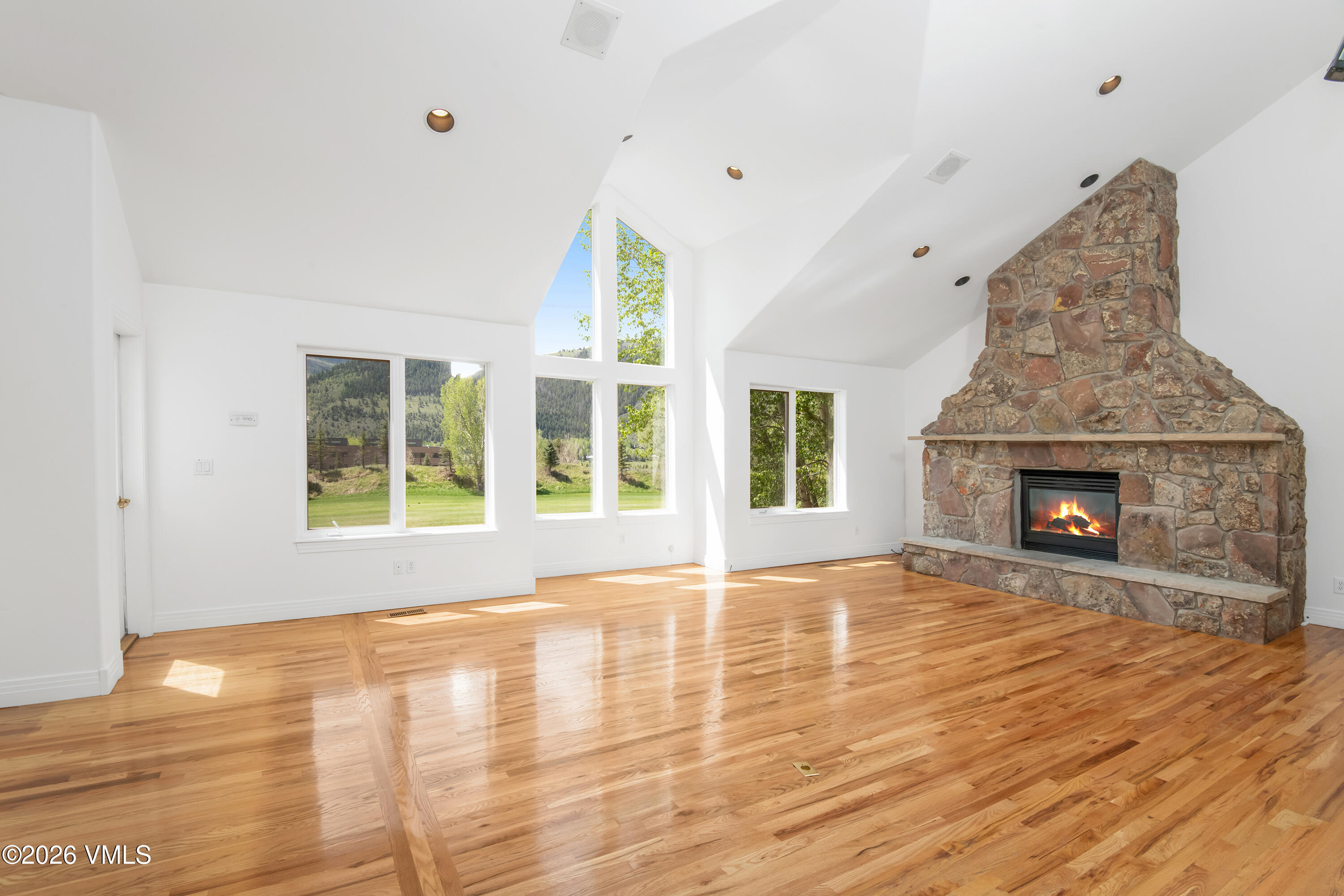 471 Rawhide Road Edwards, CO 81632 - Photo 7 of 51 a view of empty room with wooden floor and fireplace