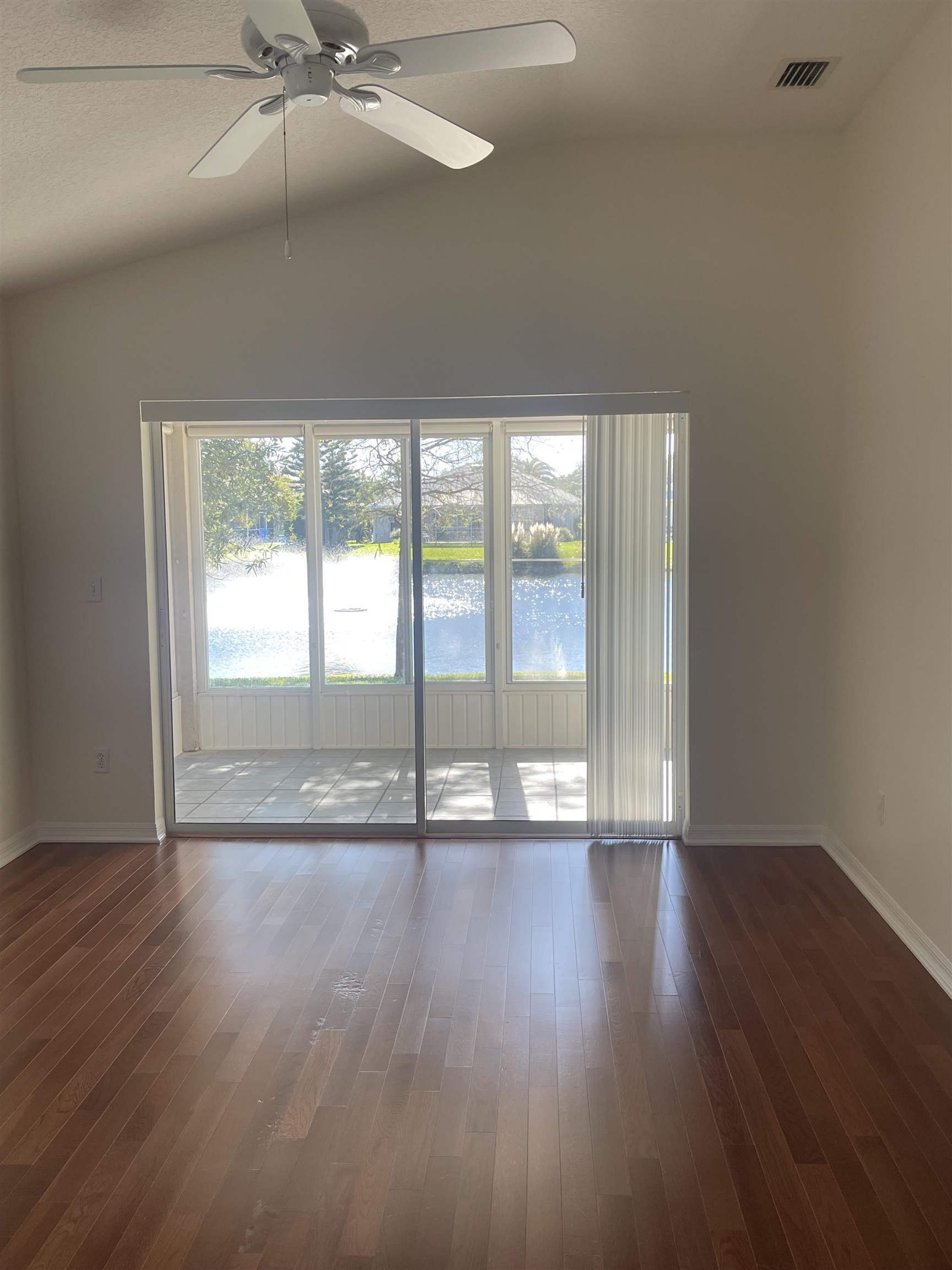 1113 Compass Row St. Augustine, FL 32080 - Photo 14 of 29 a view of an empty room with wooden floor and a window