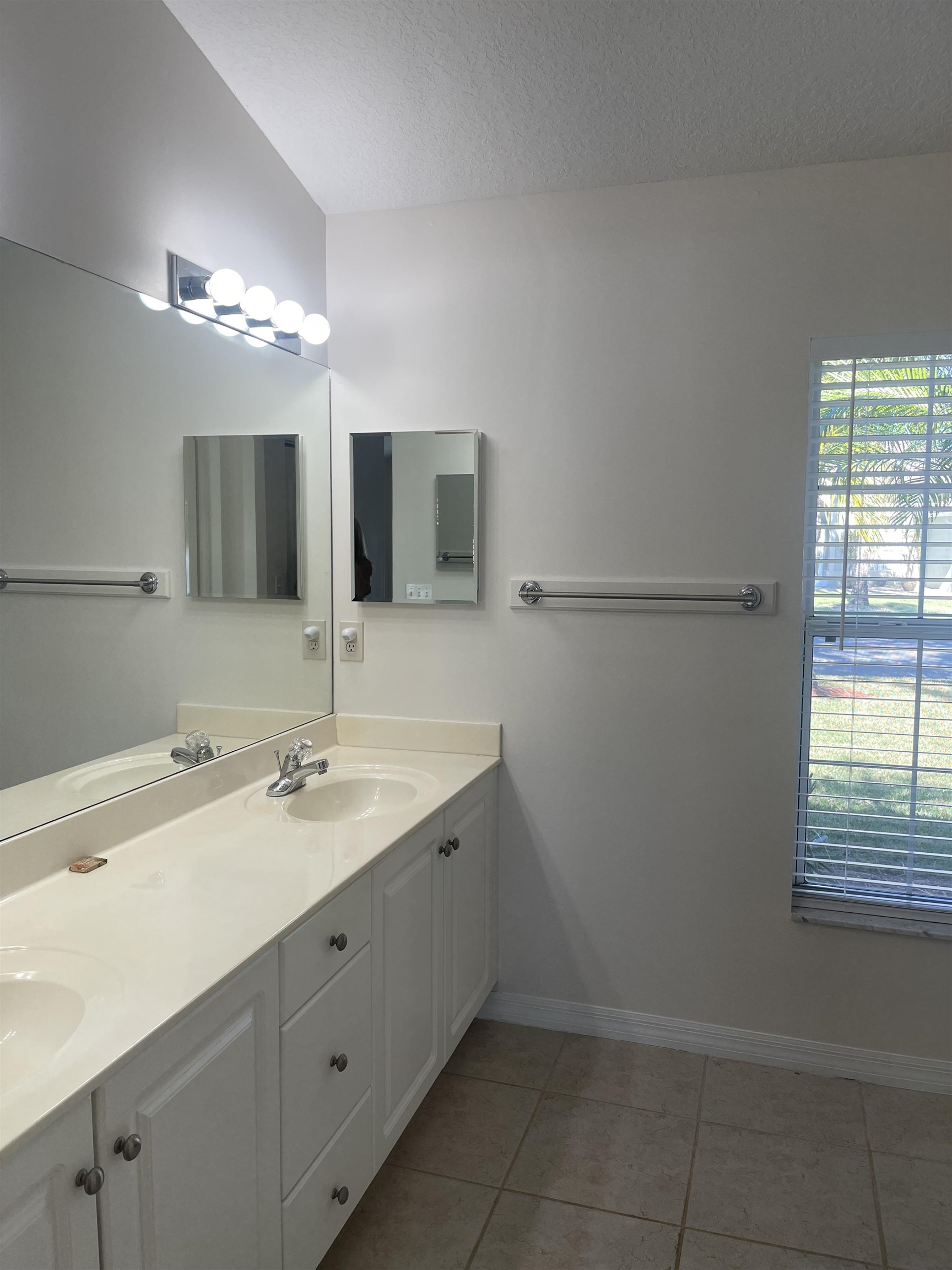 1113 Compass Row St. Augustine, FL 32080 - Photo 17 of 29 a bathroom with a sink and a mirror