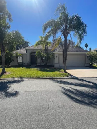 a front view of house with yard outdoor seating and barbeque oven