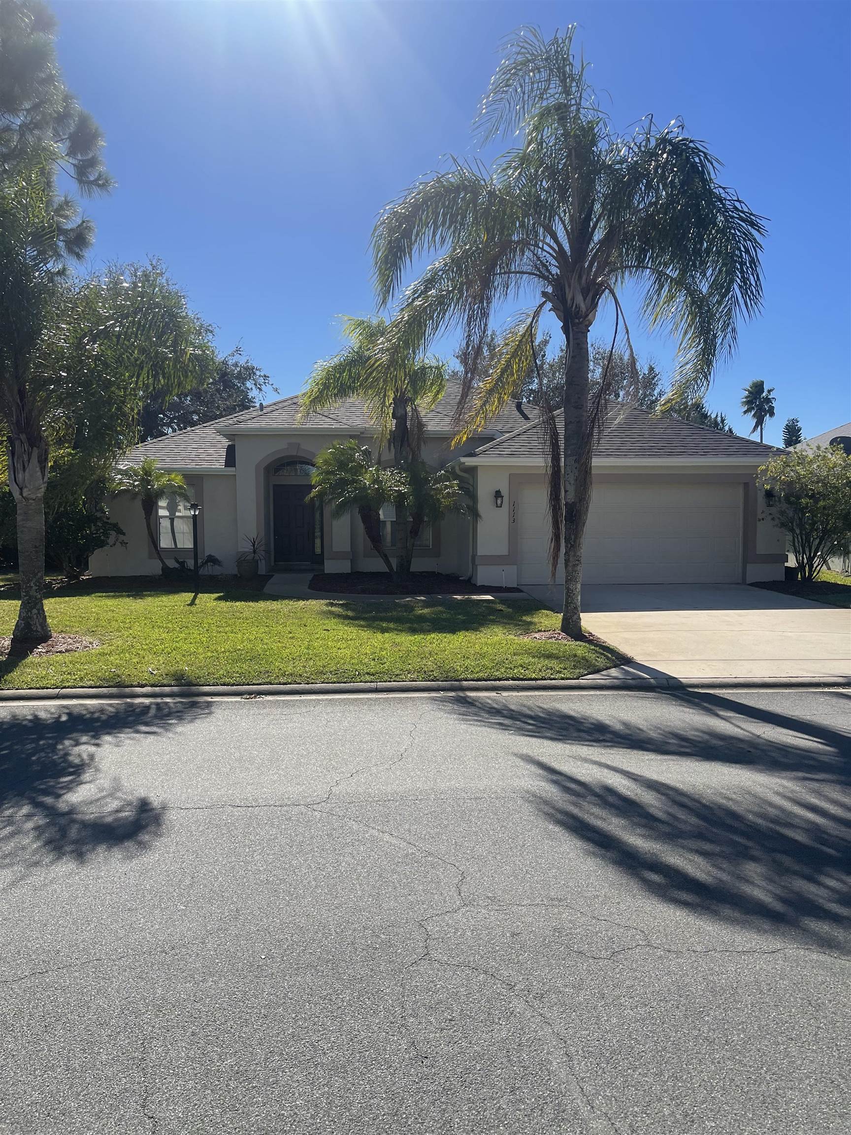 1113 Compass Row St. Augustine, FL 32080 - Photo 2 of 29 a view of a house with swimming pool and a yard