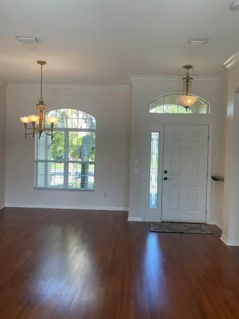 a view of kitchen with granite countertop cabinets and wooden floor