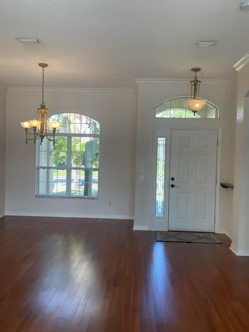 a view of kitchen with granite countertop cabinets and wooden floor
