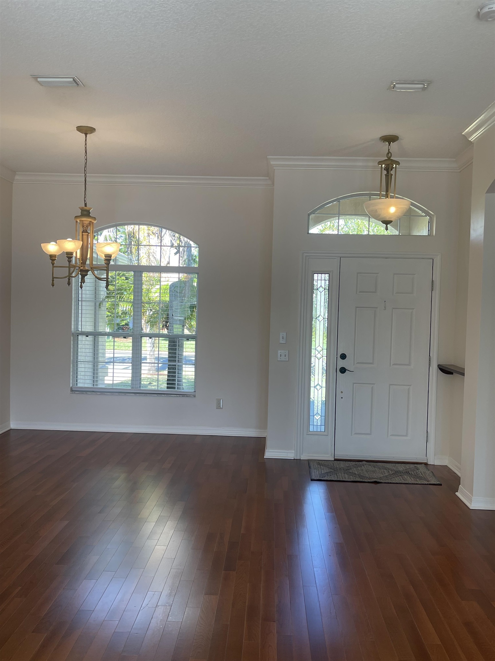 1113 Compass Row St. Augustine, FL 32080 - Photo 5 of 29 an empty room with wooden floor and windows