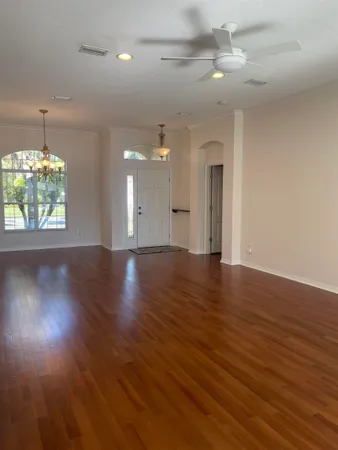 a view of a room with wooden floor