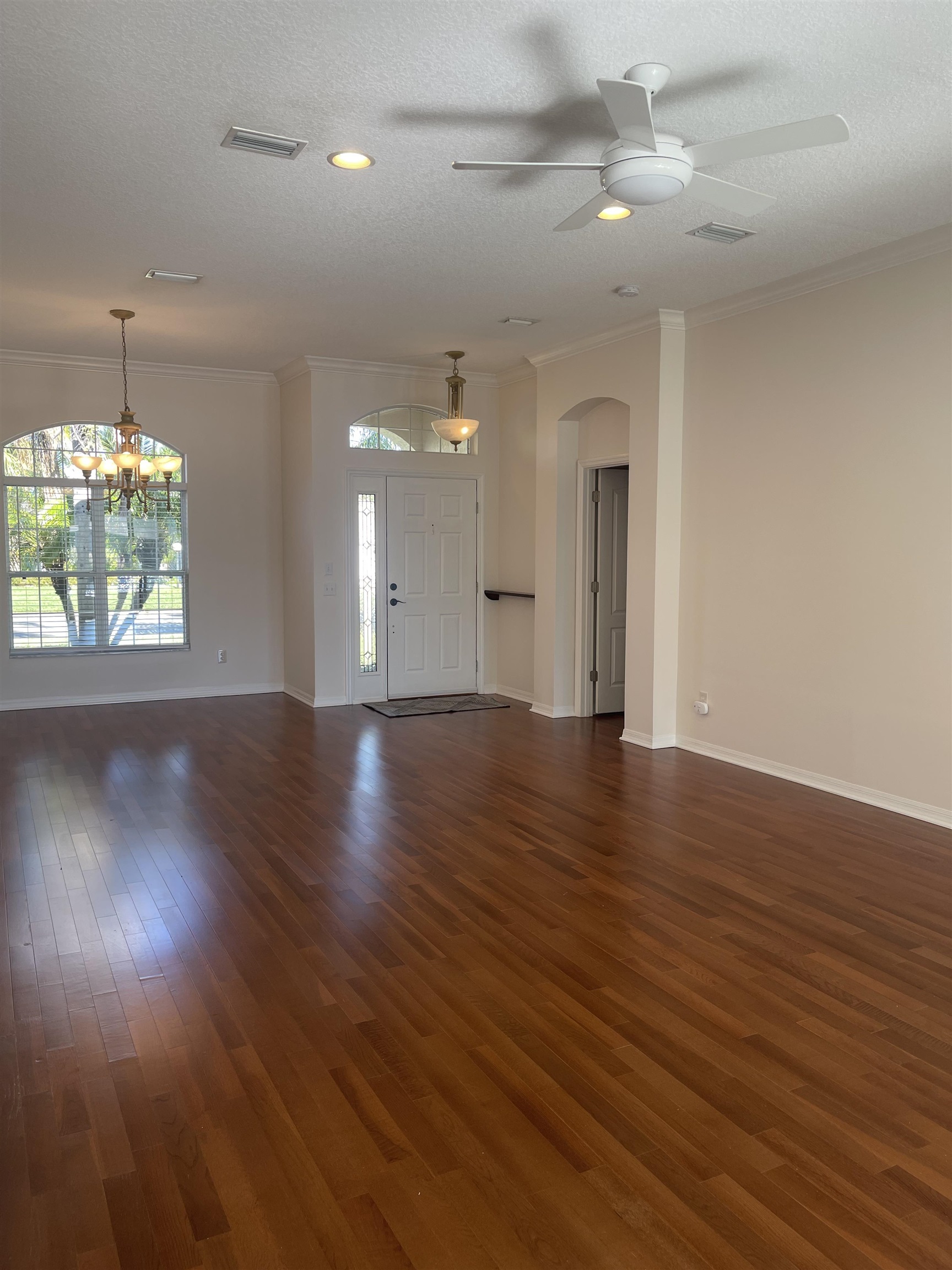 1113 Compass Row St. Augustine, FL 32080 - Photo 7 of 29 an empty room with wooden floor and windows