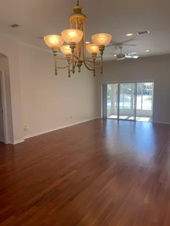 a kitchen with a sink a counter top space cabinets and stainless steel appliances