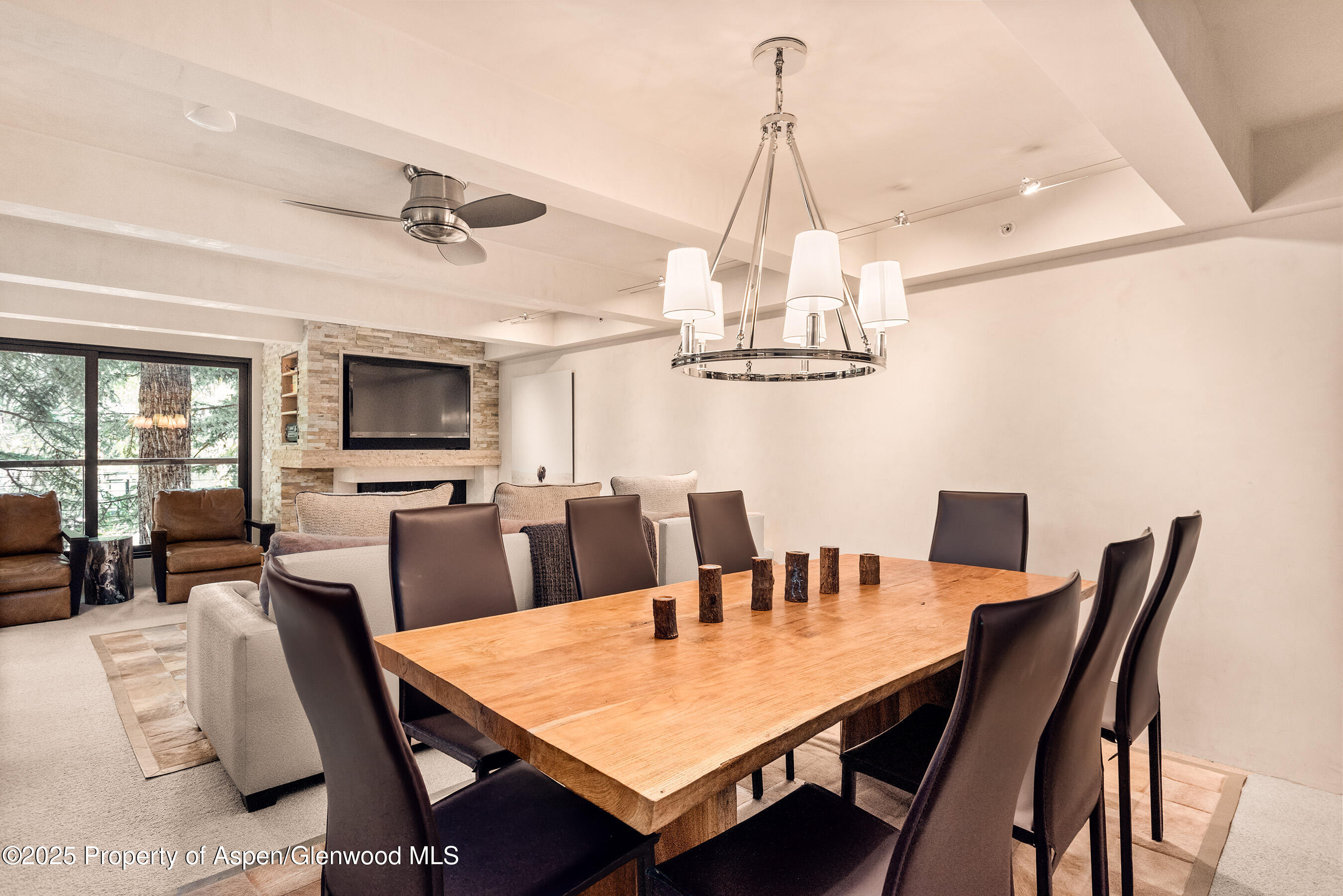 1034 East Cooper Avenue, Unit 26 Aspen, CO 81611 - Photo 7 of 23 a view of a dining room with furniture