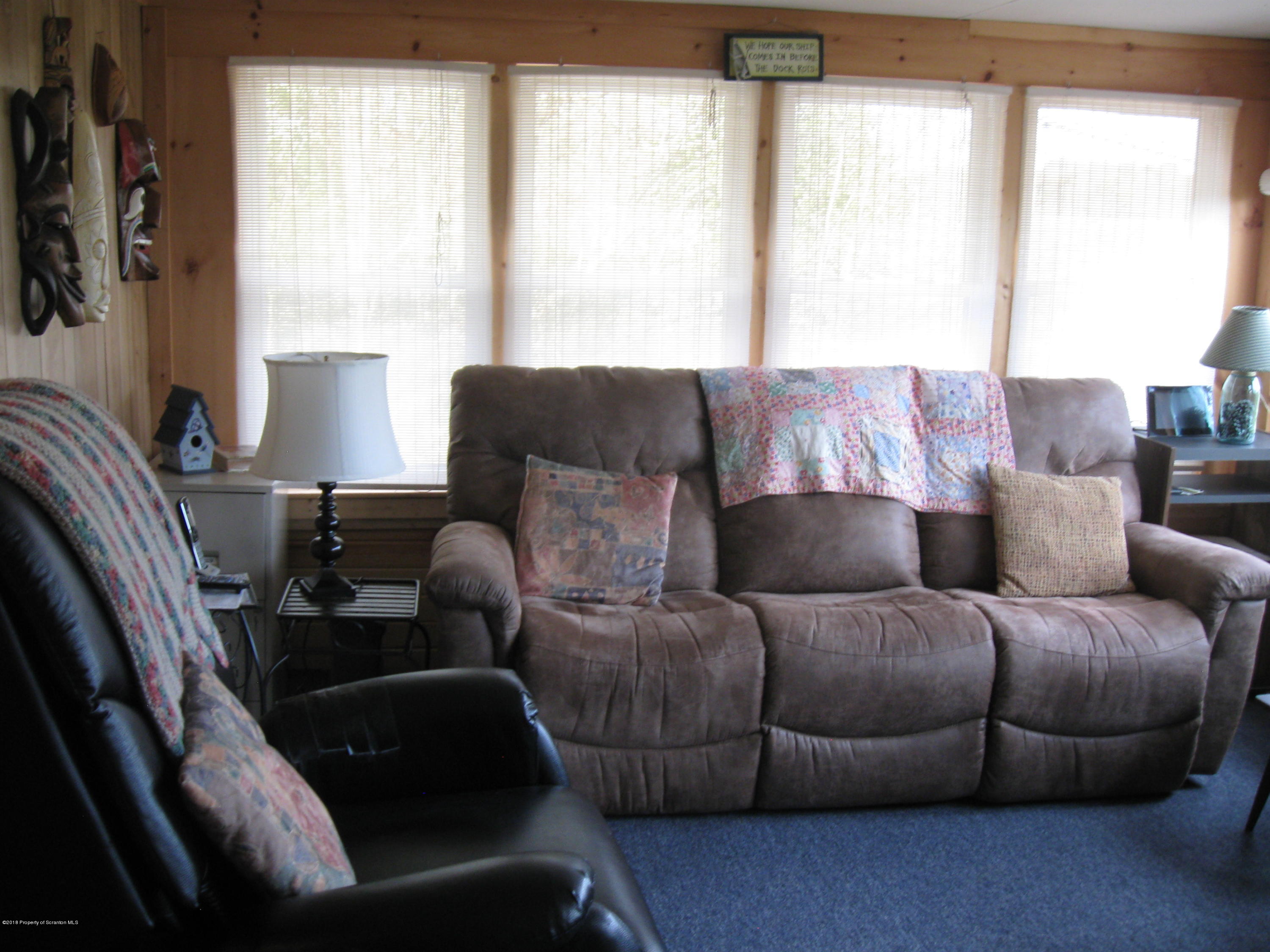 2744 State Rte 3013 Springville, PA 18844 - Photo 11 of 46 a living room with furniture and a window
