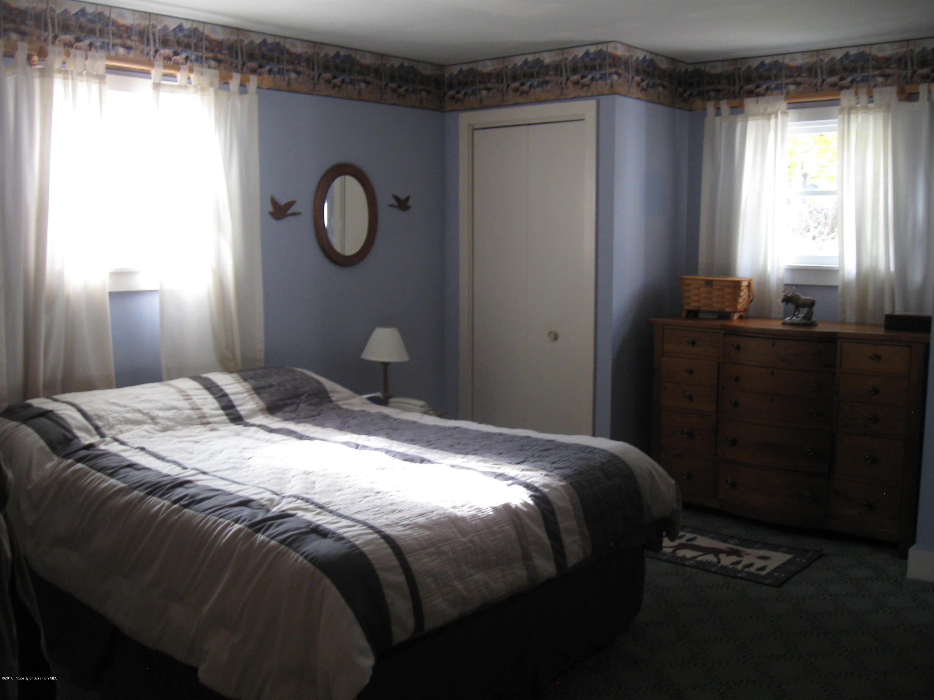 2744 State Rte 3013 Springville, PA 18844 - Photo 15 of 46 a bedroom with a bed and a window