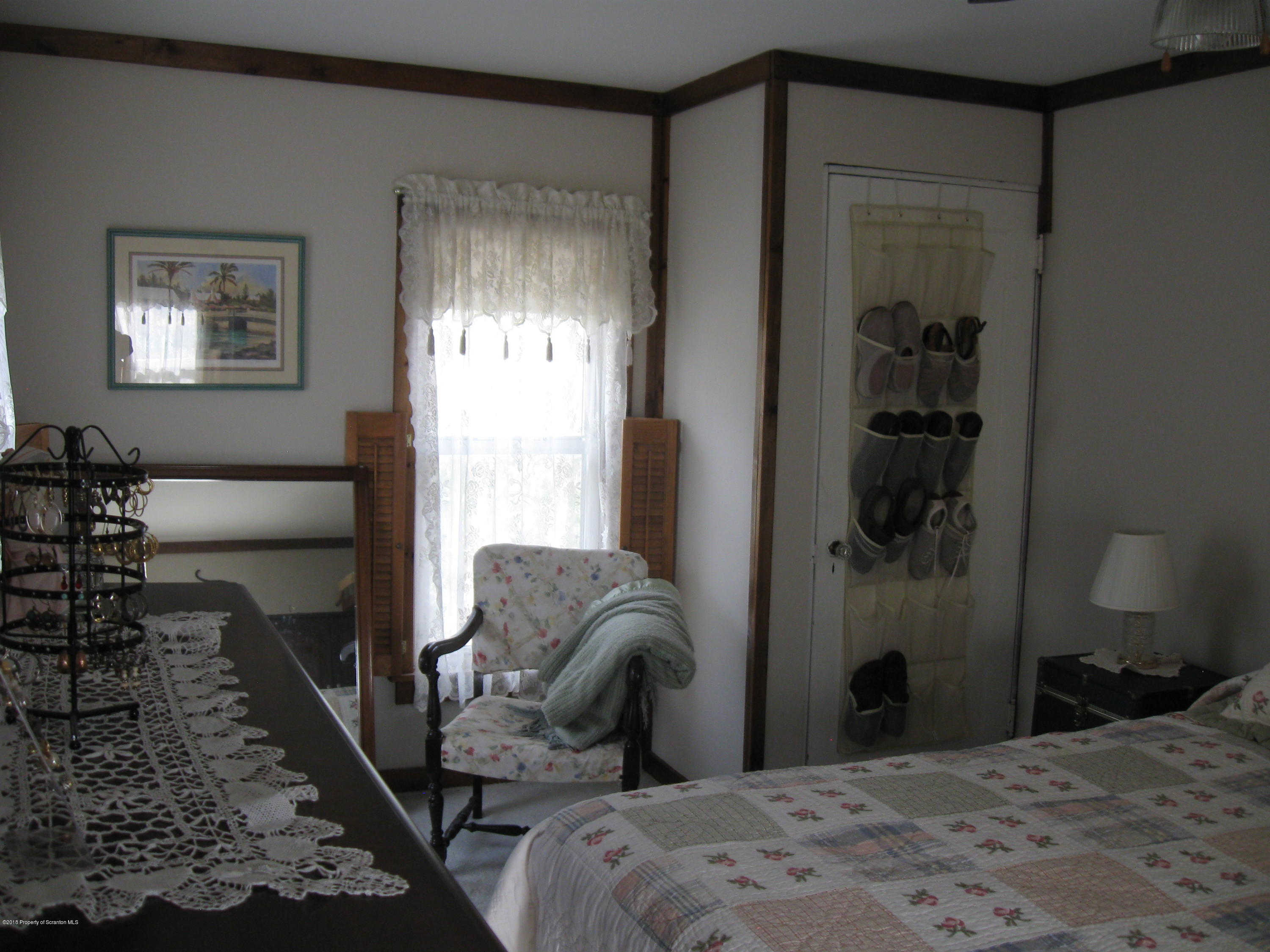 2744 State Rte 3013 Springville, PA 18844 - Photo 24 of 46 a bedroom with a bed and a window