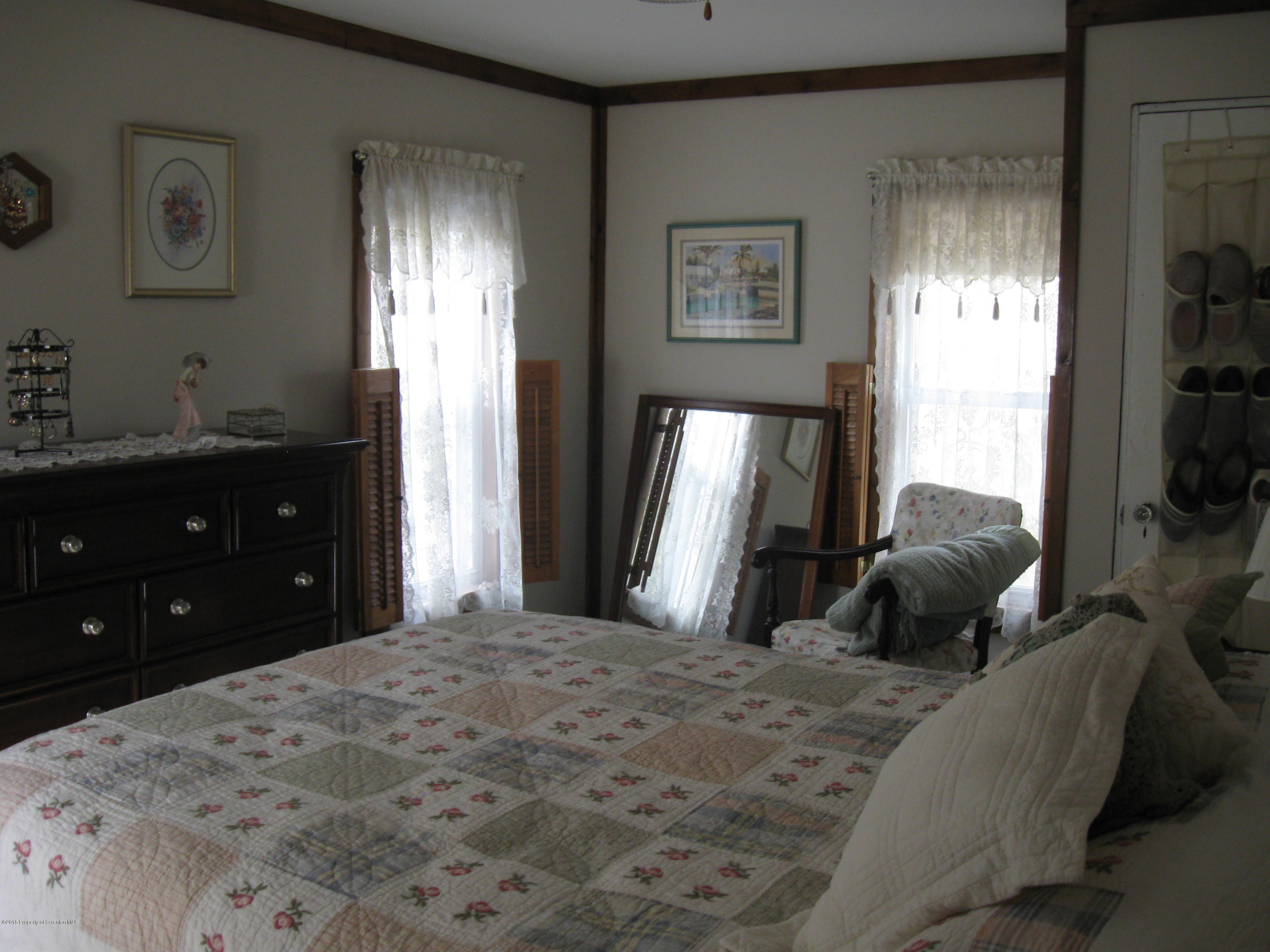 2744 State Rte 3013 Springville, PA 18844 - Photo 26 of 46 a bedroom with a bed and a window
