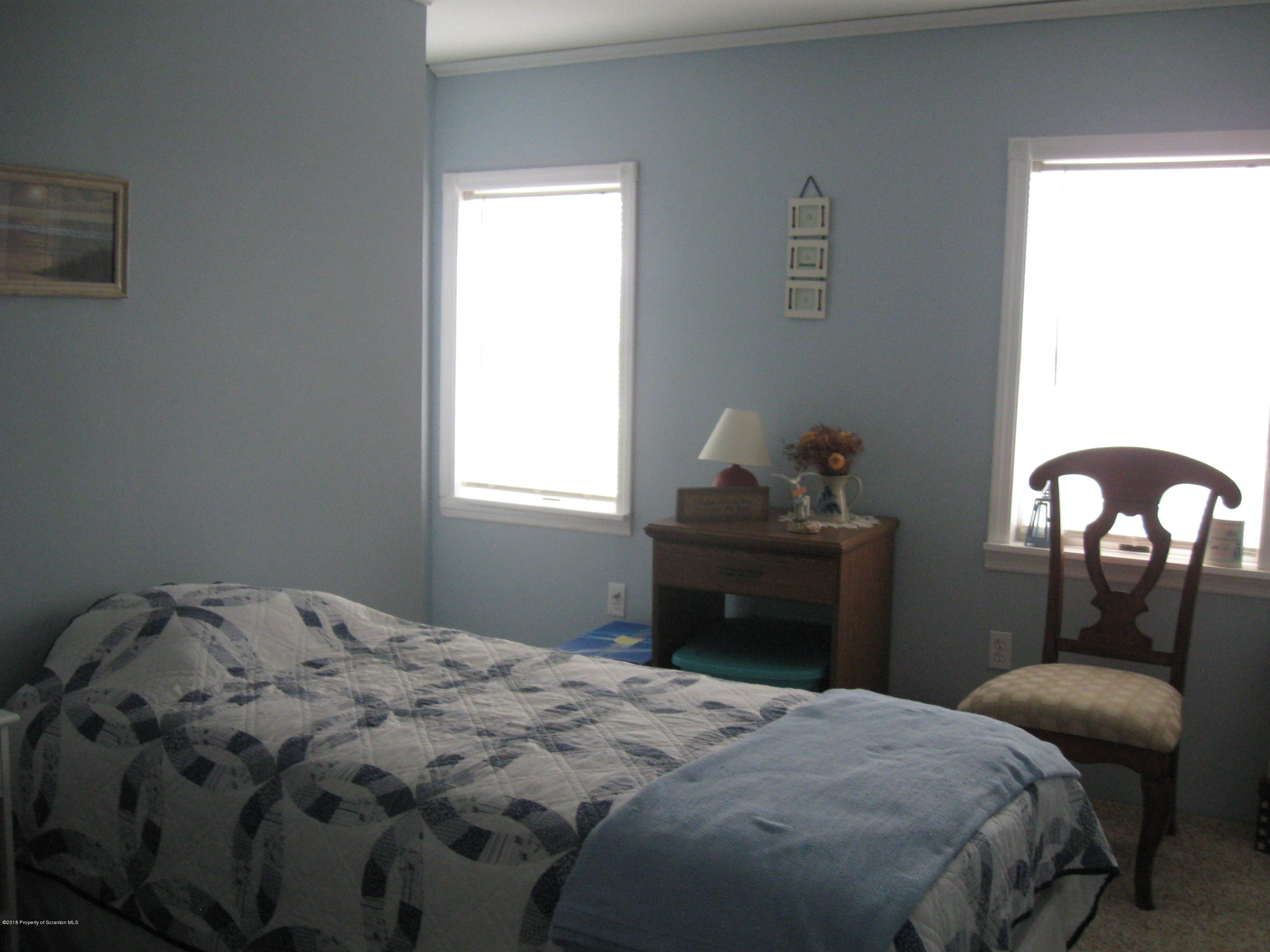 2744 State Rte 3013 Springville, PA 18844 - Photo 27 of 46 a bedroom with a bed and a window