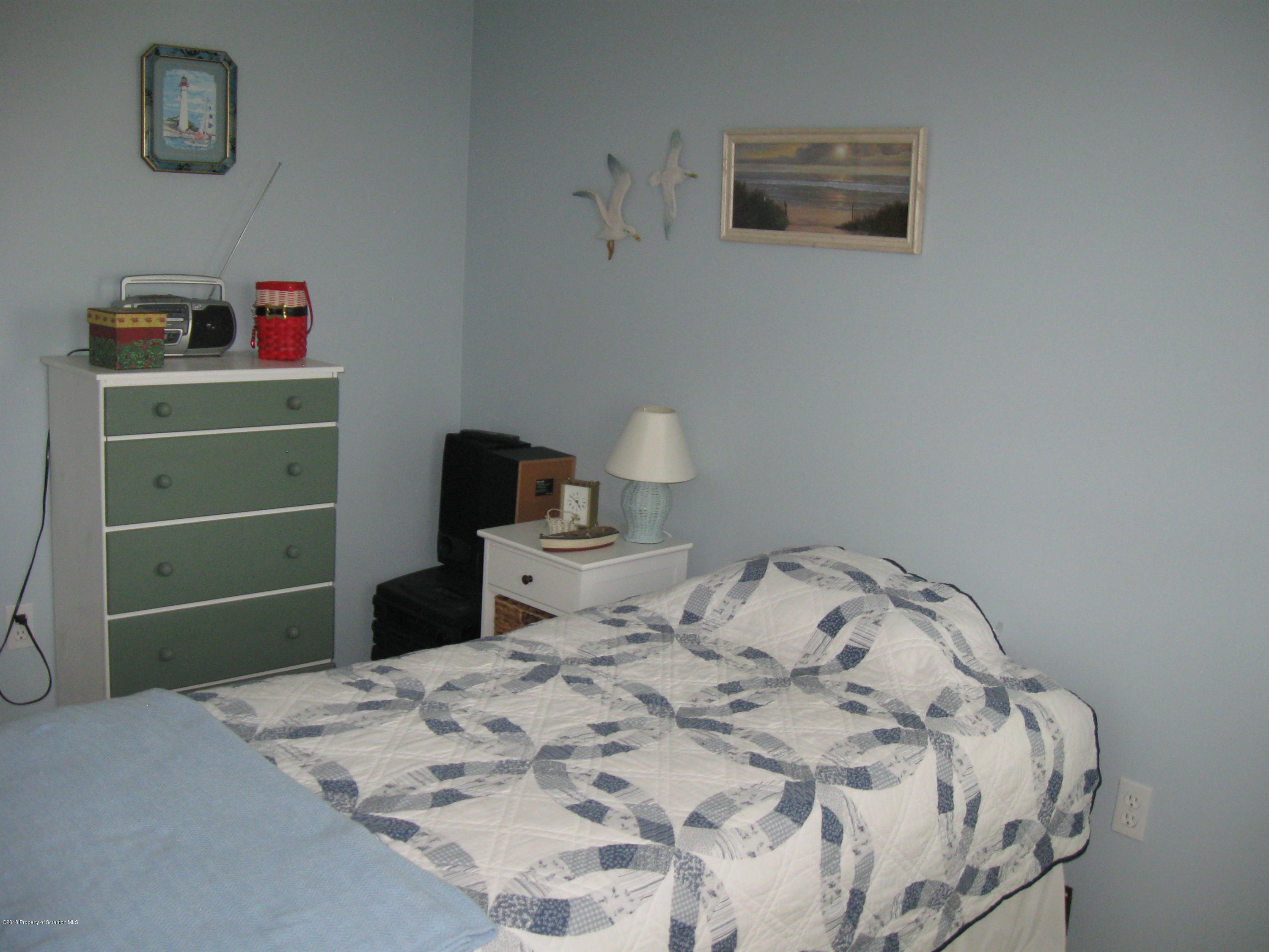2744 State Rte 3013 Springville, PA 18844 - Photo 28 of 46 a bedroom with a bed and a cabinets