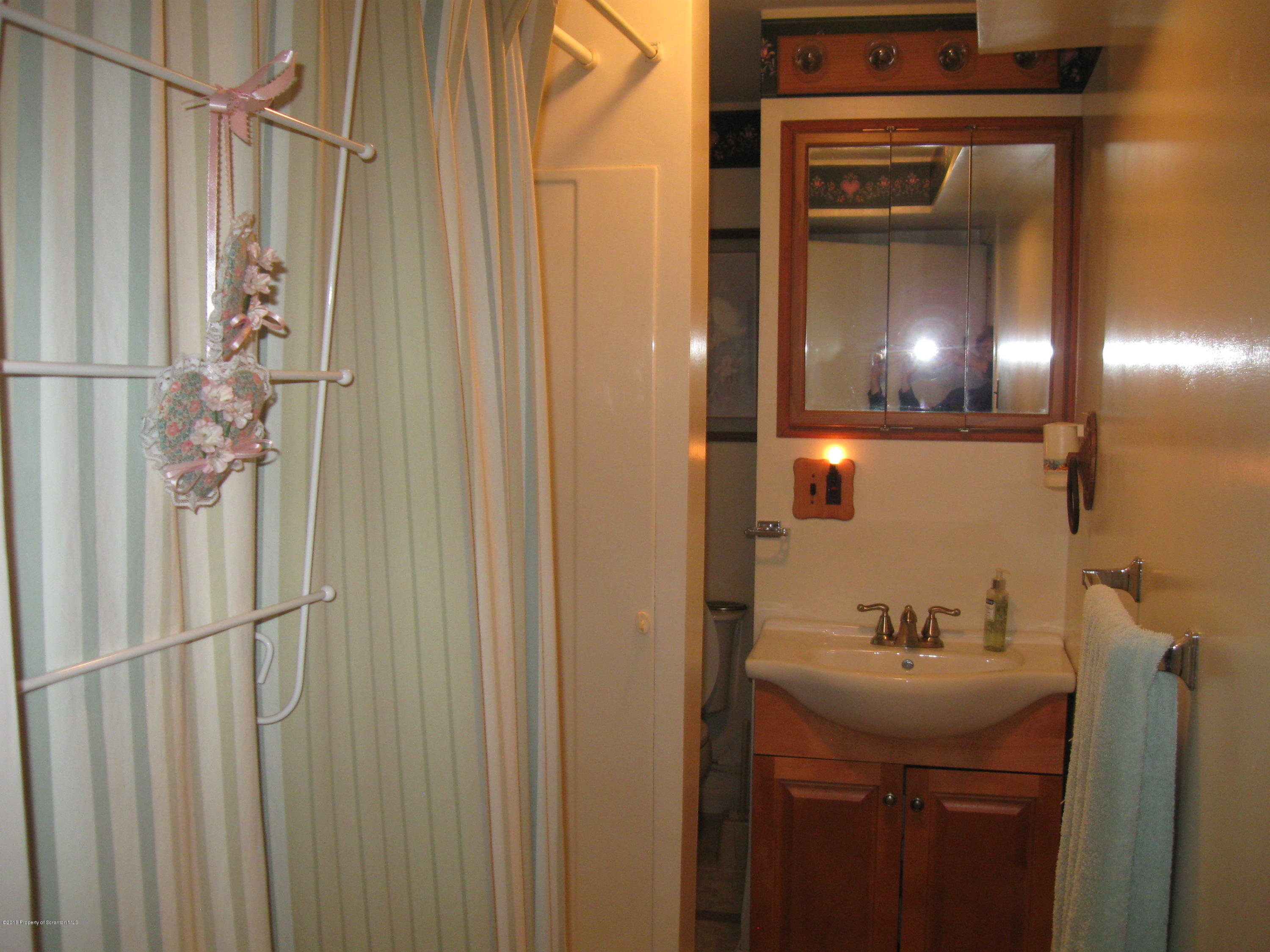 2744 State Rte 3013 Springville, PA 18844 - Photo 30 of 46 a bathroom with a sink and mirror