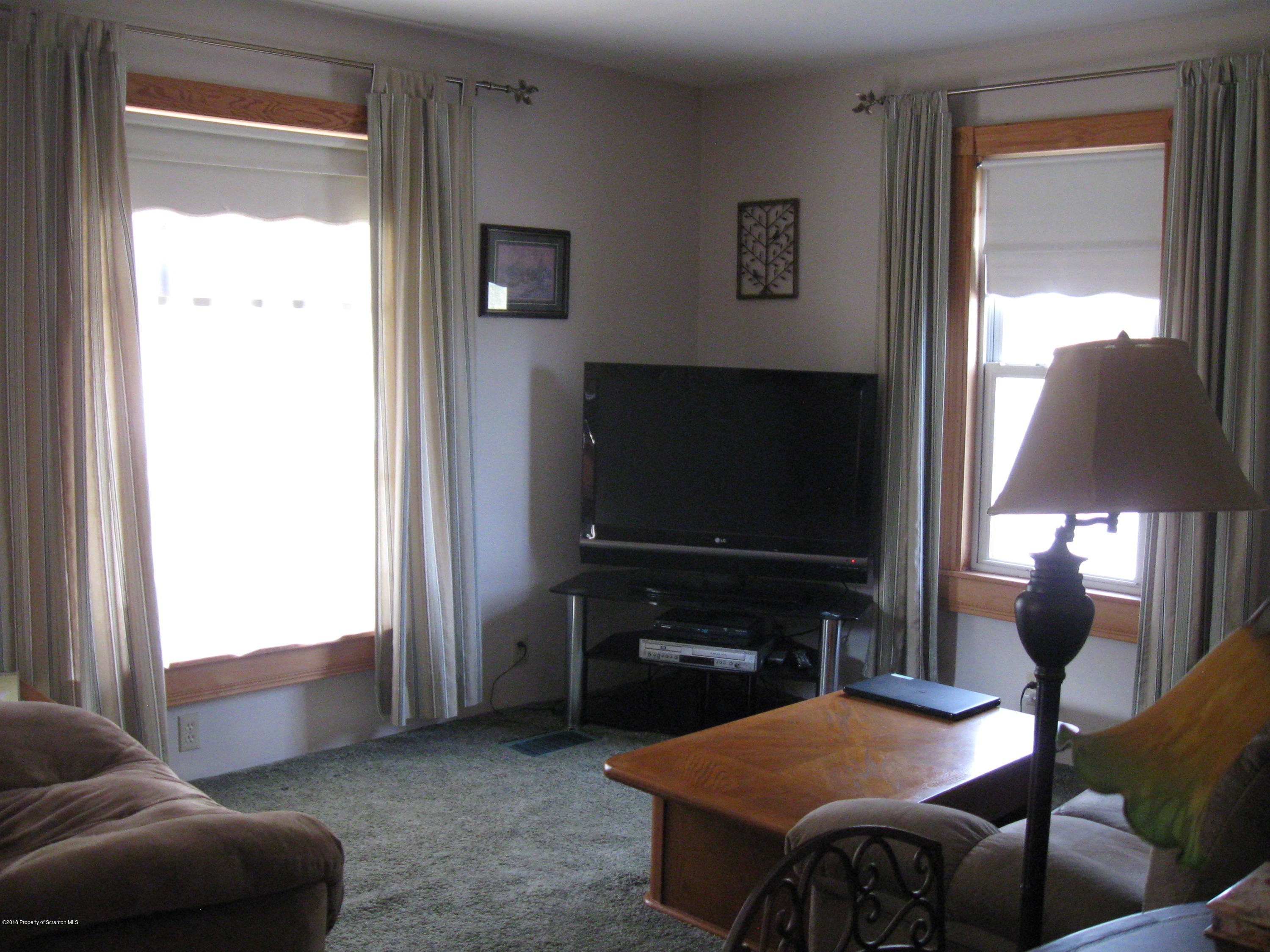 2744 State Rte 3013 Springville, PA 18844 - Photo 6 of 46 a living room with furniture and a flat screen tv