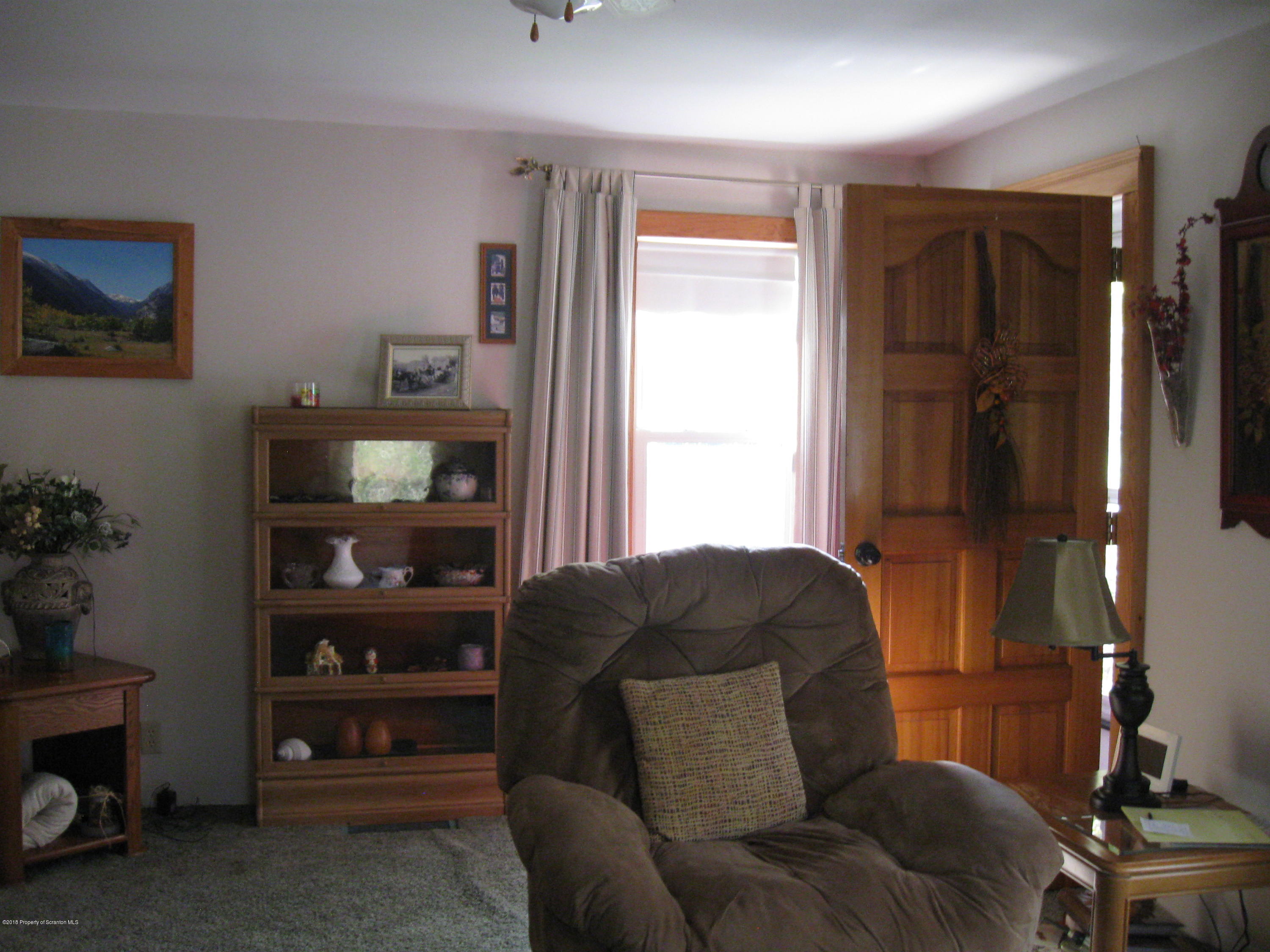 2744 State Rte 3013 Springville, PA 18844 - Photo 7 of 46 a living room with furniture and a window