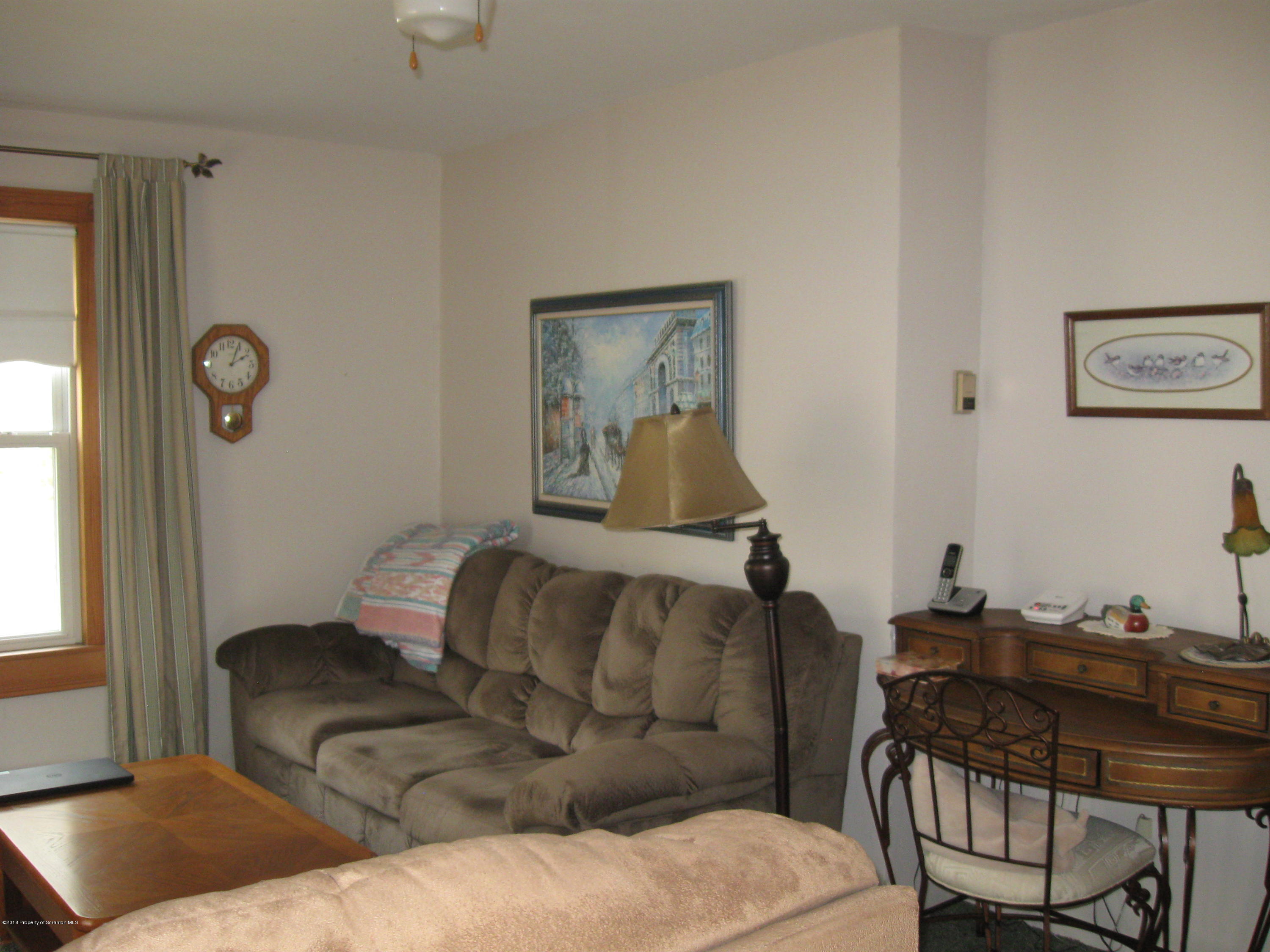 2744 State Rte 3013 Springville, PA 18844 - Photo 8 of 46 a living room with furniture and a window