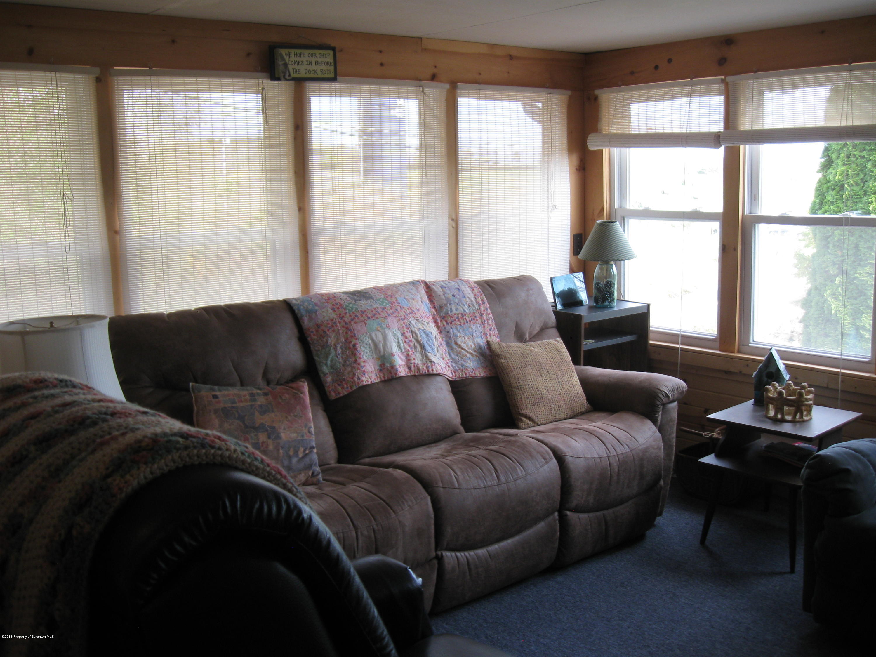 2744 State Rte 3013 Springville, PA 18844 - Photo 9 of 46 a living room with furniture and a large window