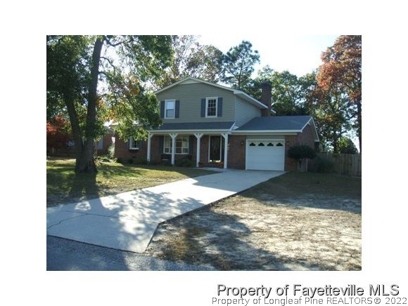 3024 Rouse Road Fayetteville, NC 28306 - Photo 1 of 12 a view of a house with backyard