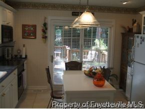 3024 Rouse Road Fayetteville, NC 28306 - Photo 6 of 12 a view of a dining room with furniture window and outside view