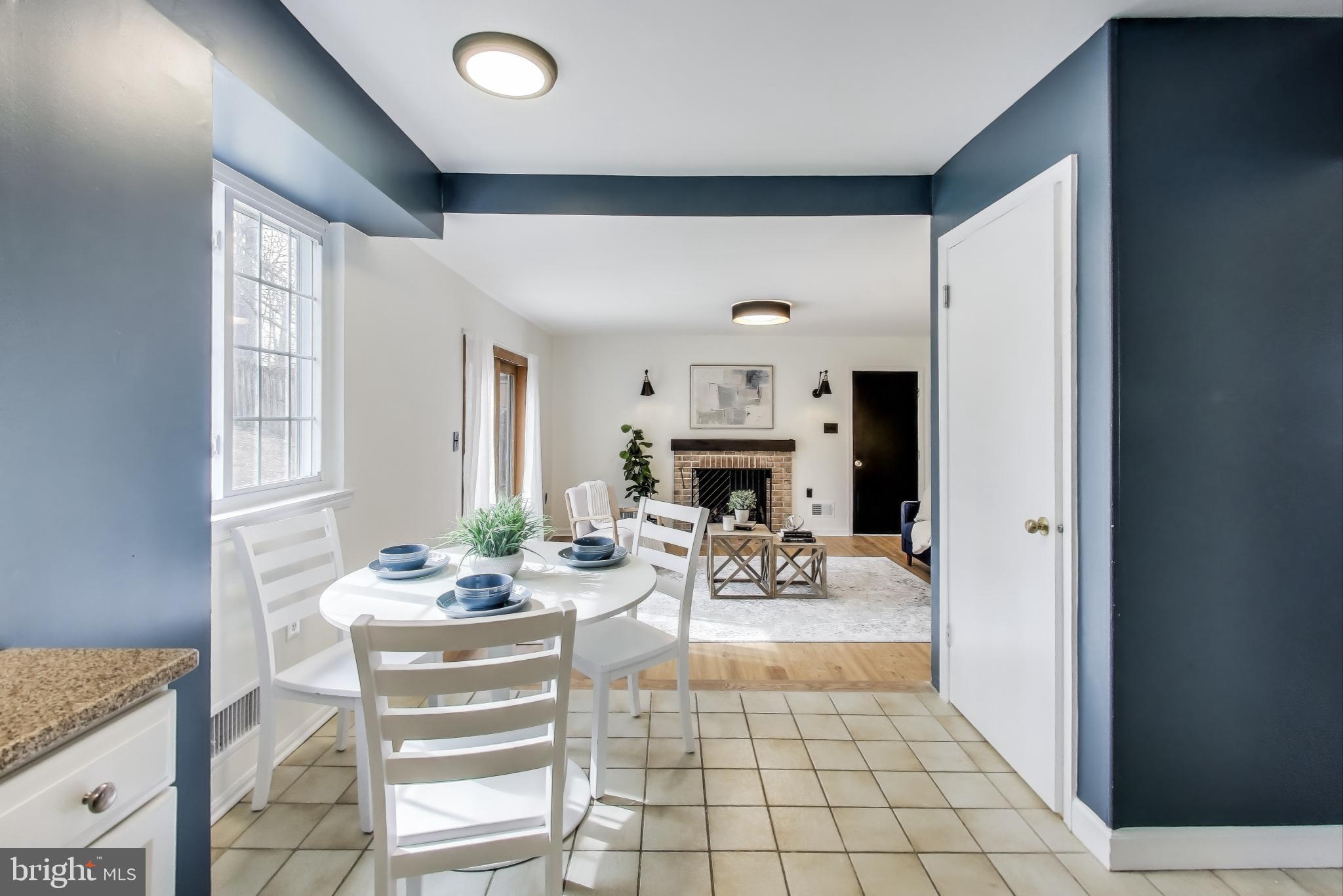 9023 Brook Ford Road Burke, VA 22015 - Photo 12 of 43 a view of a dining room with furniture window and outside view