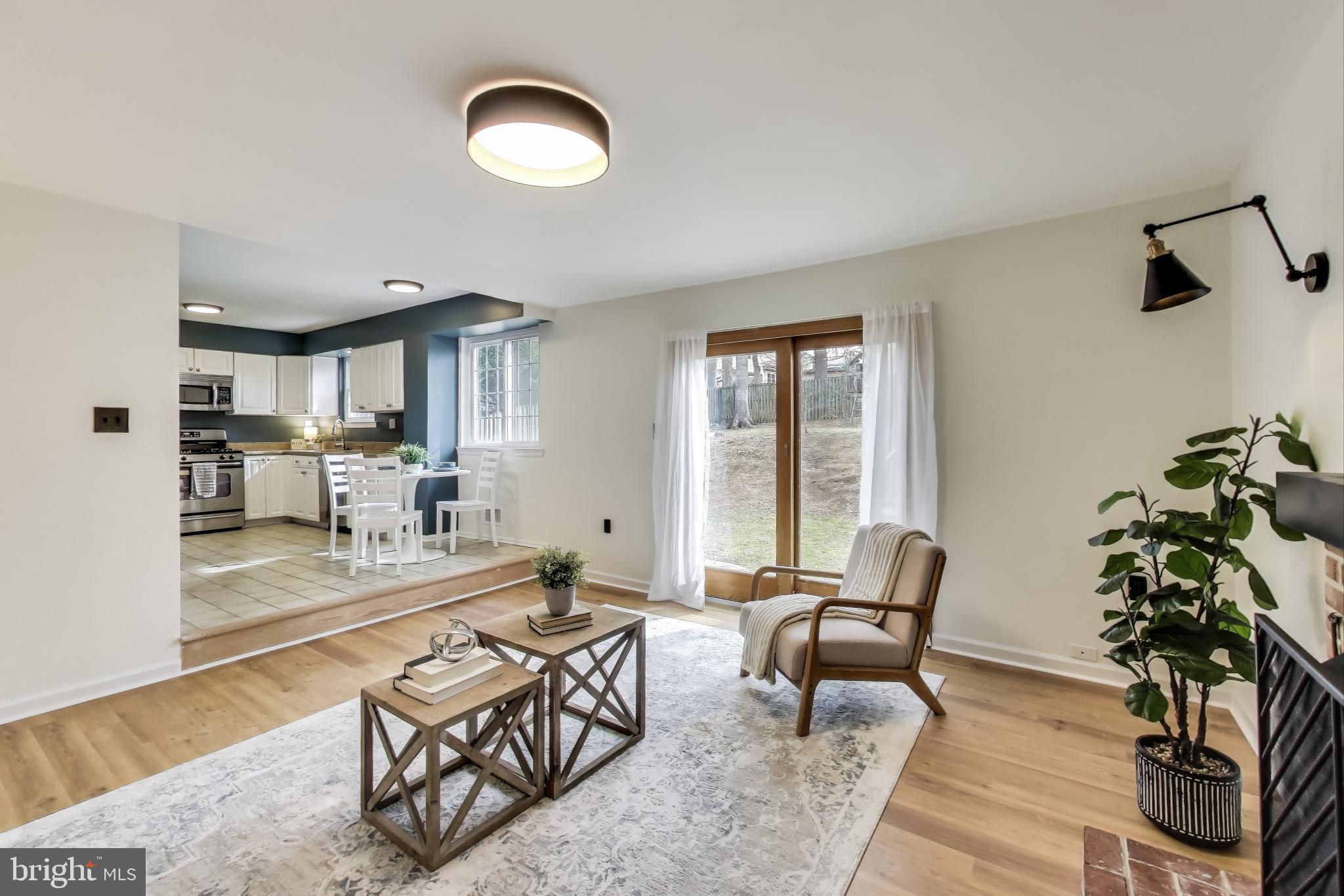 9023 Brook Ford Road Burke, VA 22015 - Photo 14 of 43 a living room with furniture and a potted plant