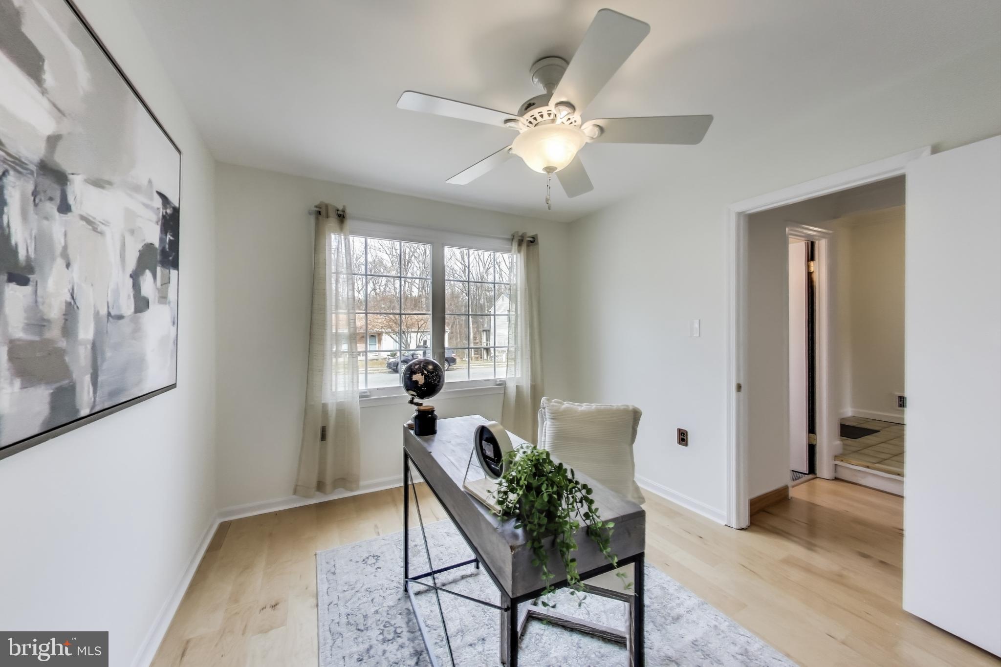 9023 Brook Ford Road Burke, VA 22015 - Photo 17 of 43 a living room with furniture and wooden floor