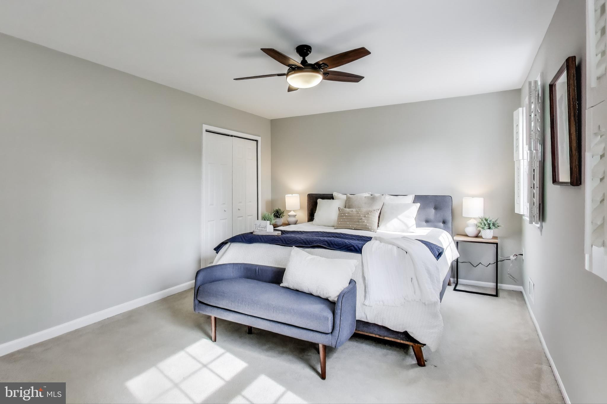 9023 Brook Ford Road Burke, VA 22015 - Photo 20 of 43 a bedroom with a bed and a ceiling fan